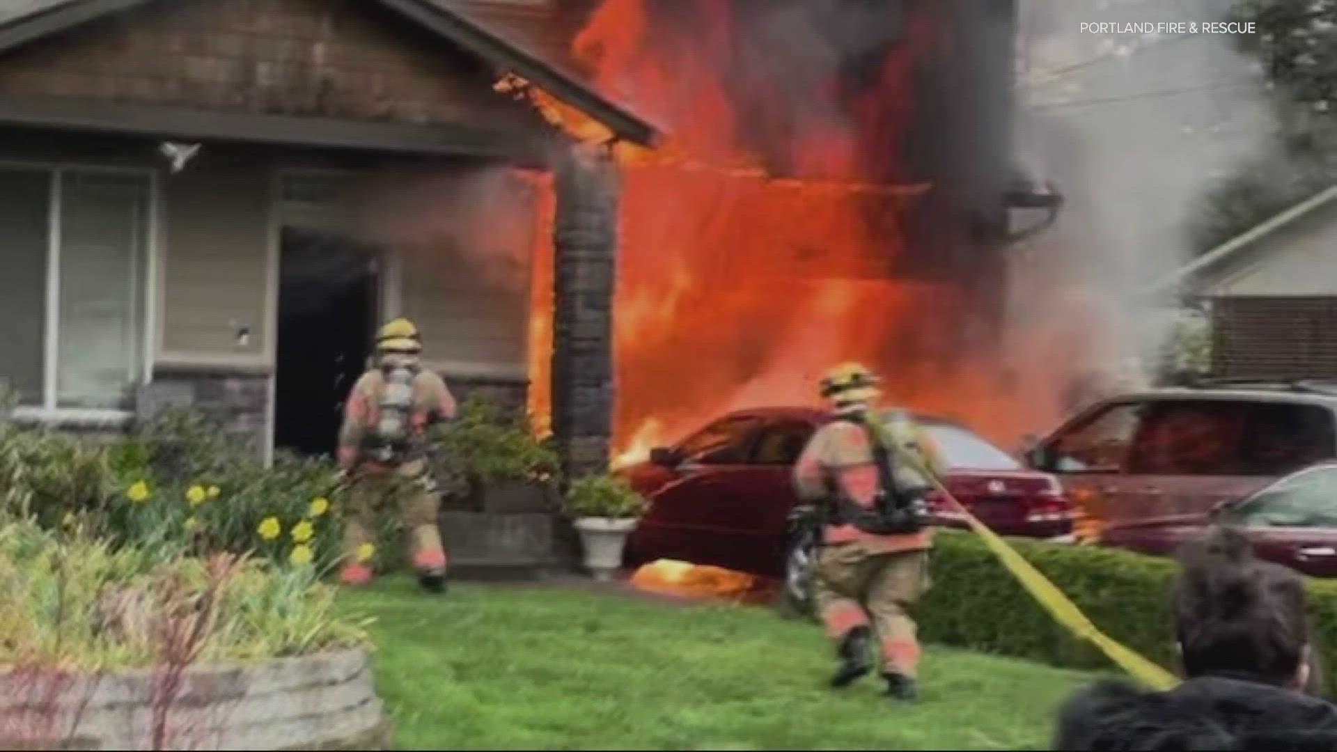 Flames spread from a garage to the house on SE Tibbetts Street on Sunday morning, Portland Fire & Rescue said.