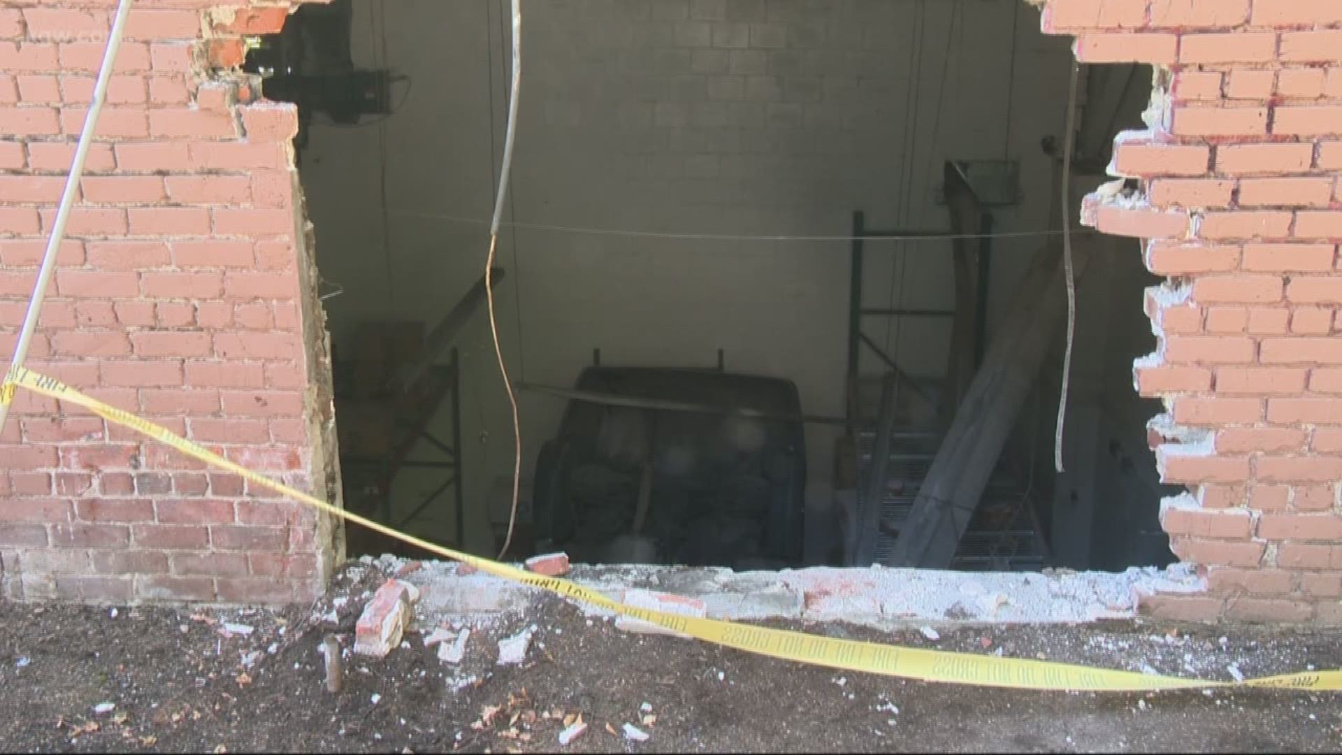 A car crashed into a building in Southwest Portland's Goose Hollow neighborhood. The car went through a wall and came to rest upside down a floor below.
