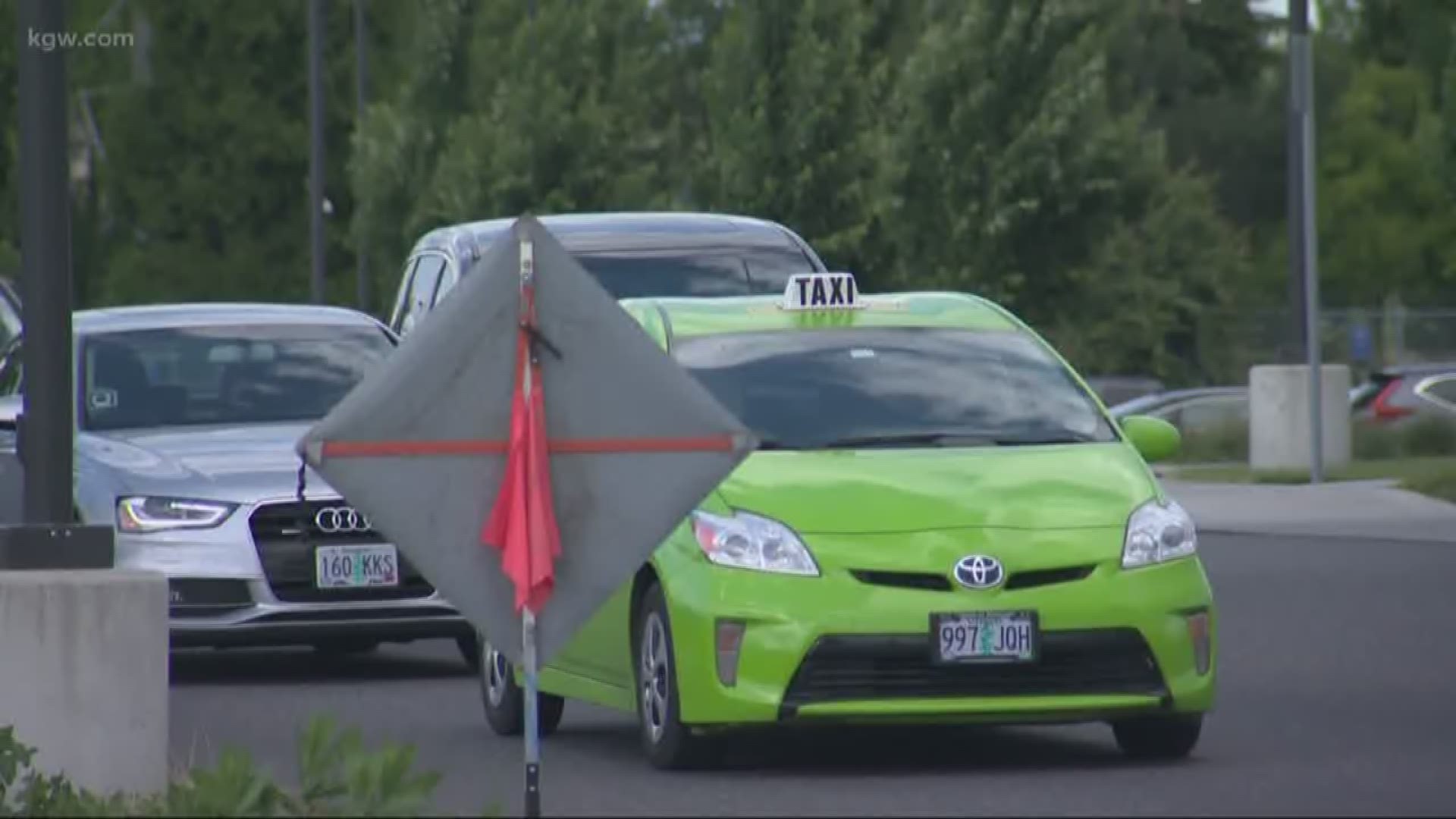 Portland International Airport new rideshare system helps relieve congestion in the terminal but congestion in the cell phone waiting area continues.