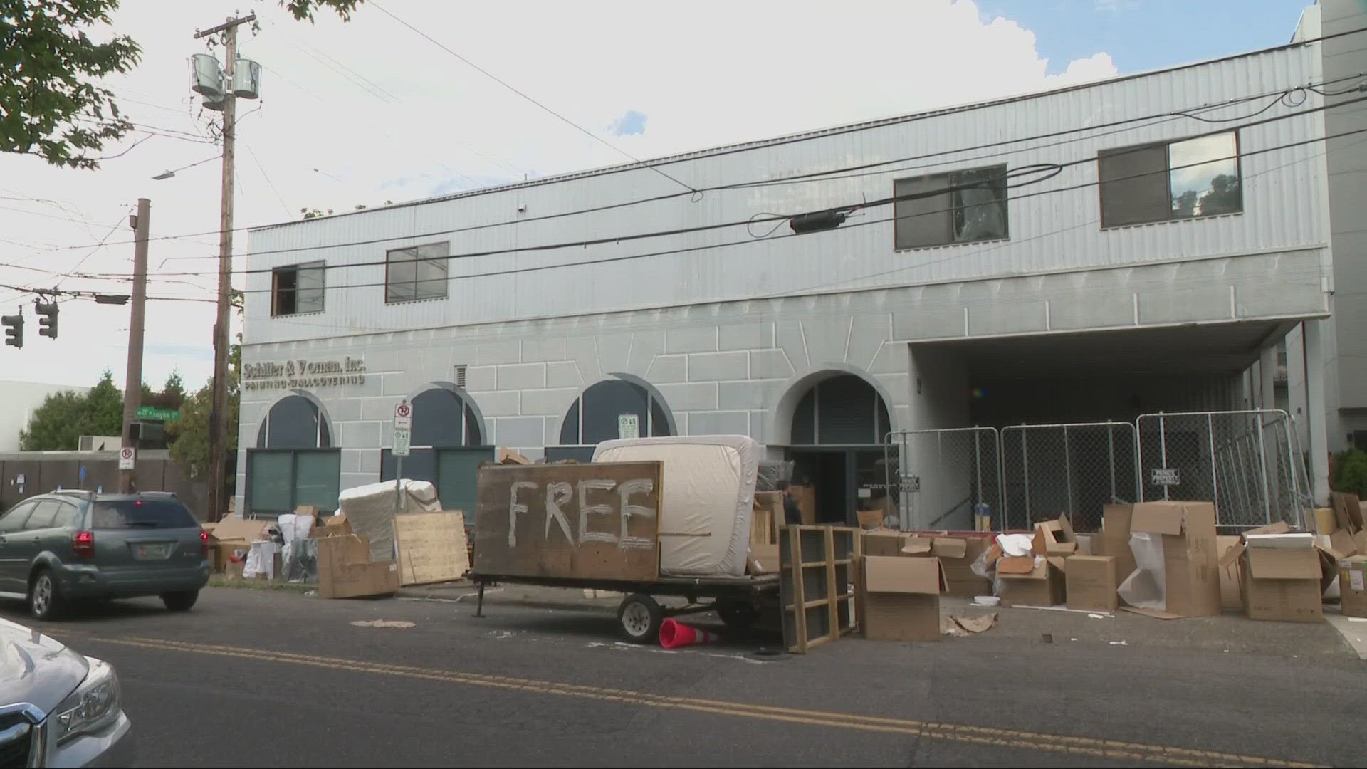 People packed the warehouse, taking items they thought were free. But it wasn't the property owner who posted the 'free' sign or allowed people to go in.