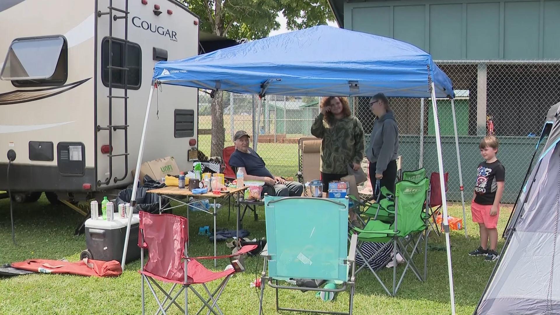 With the community of Cherry Grove under an evacuation order, families are clustered in a ballpark within the town of Gaston as they await word about their homes.