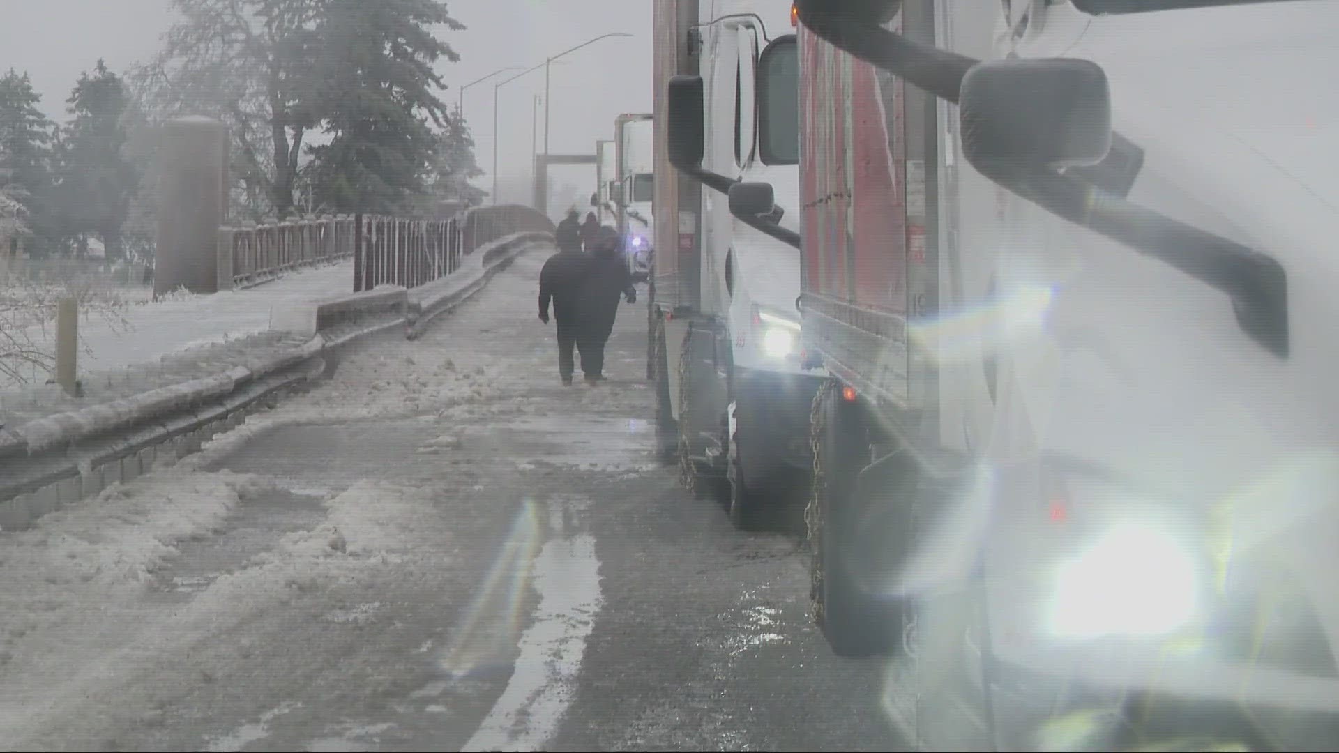 The National Weather Service issued an ice storm warning for the Columbia River Gorge through Friday morning. Trucks and trailers line I-84 as drivers put chains on.