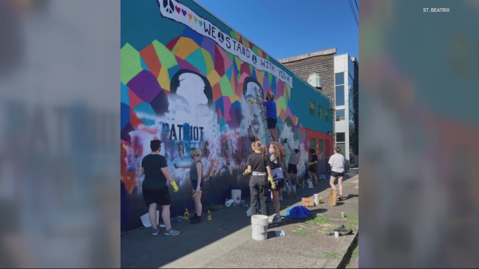 The community came together to help restore the mural.