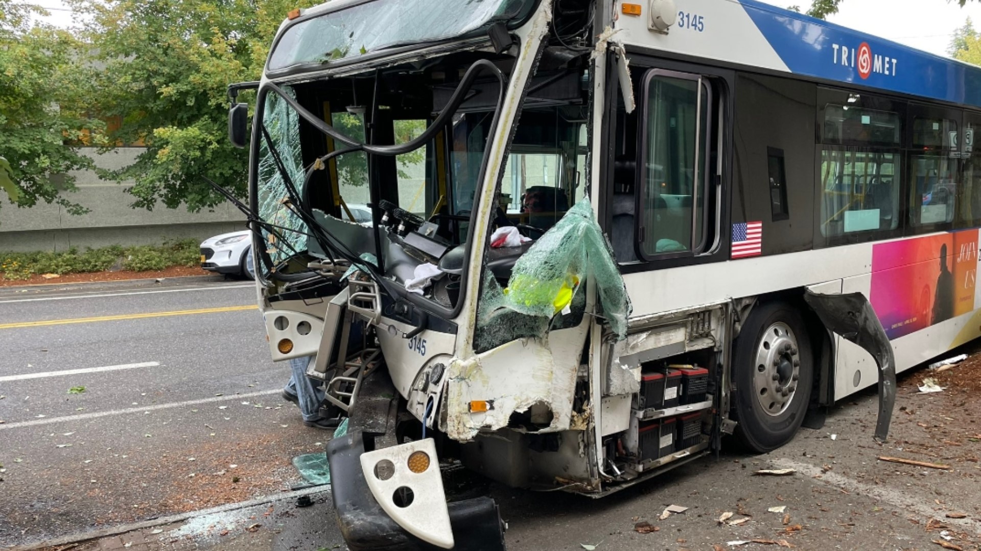 The crash happened near Northeast Glisan Street and 45th Avenue. The TriMet bus driver and three passengers were taken to the hospital, a TriMet spokesperson said.