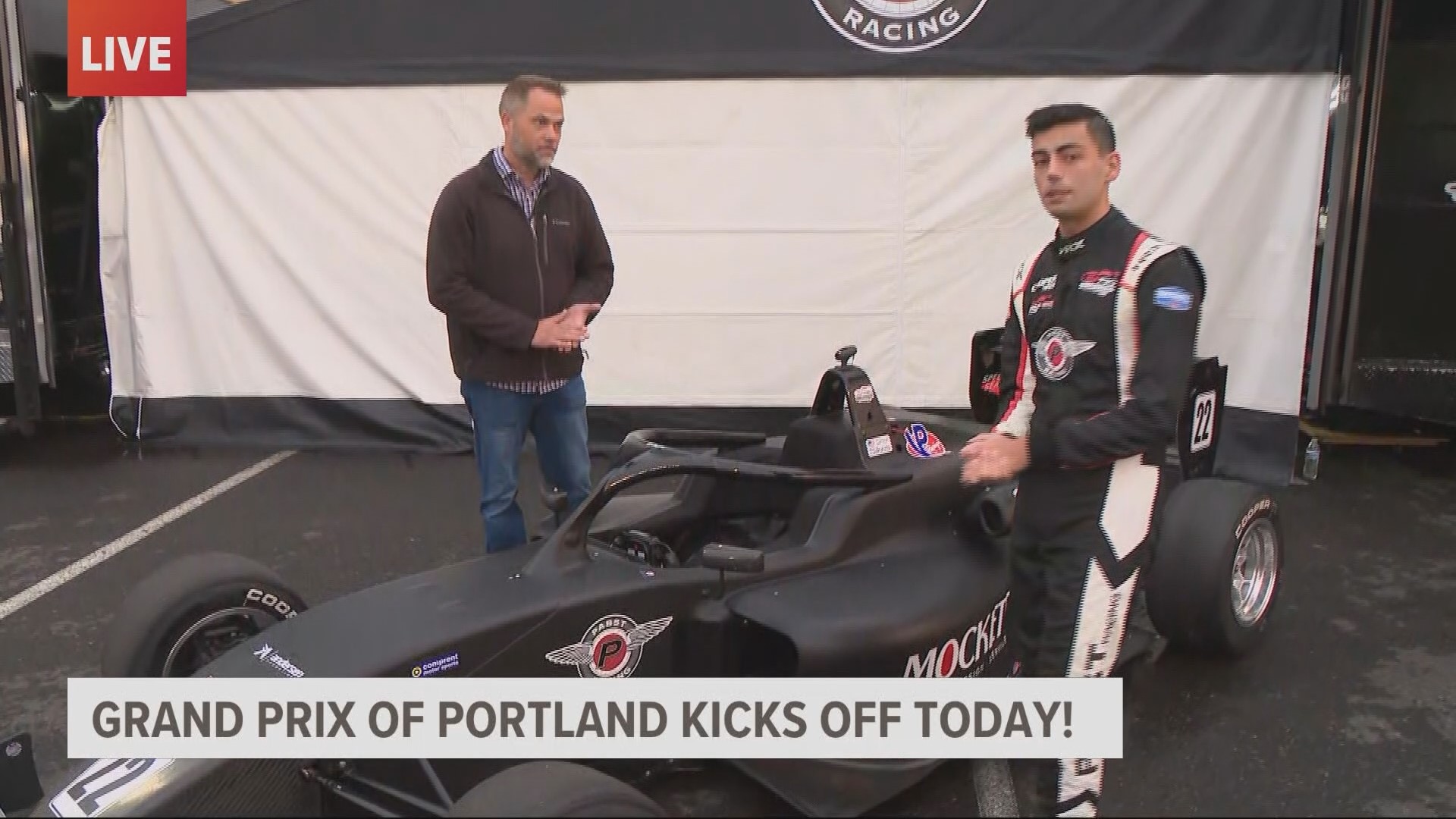 Devon Haskins talks to the VP and GM Grand Prix of Portland Jerry Jansen and USF2000 driver Simon Sikes