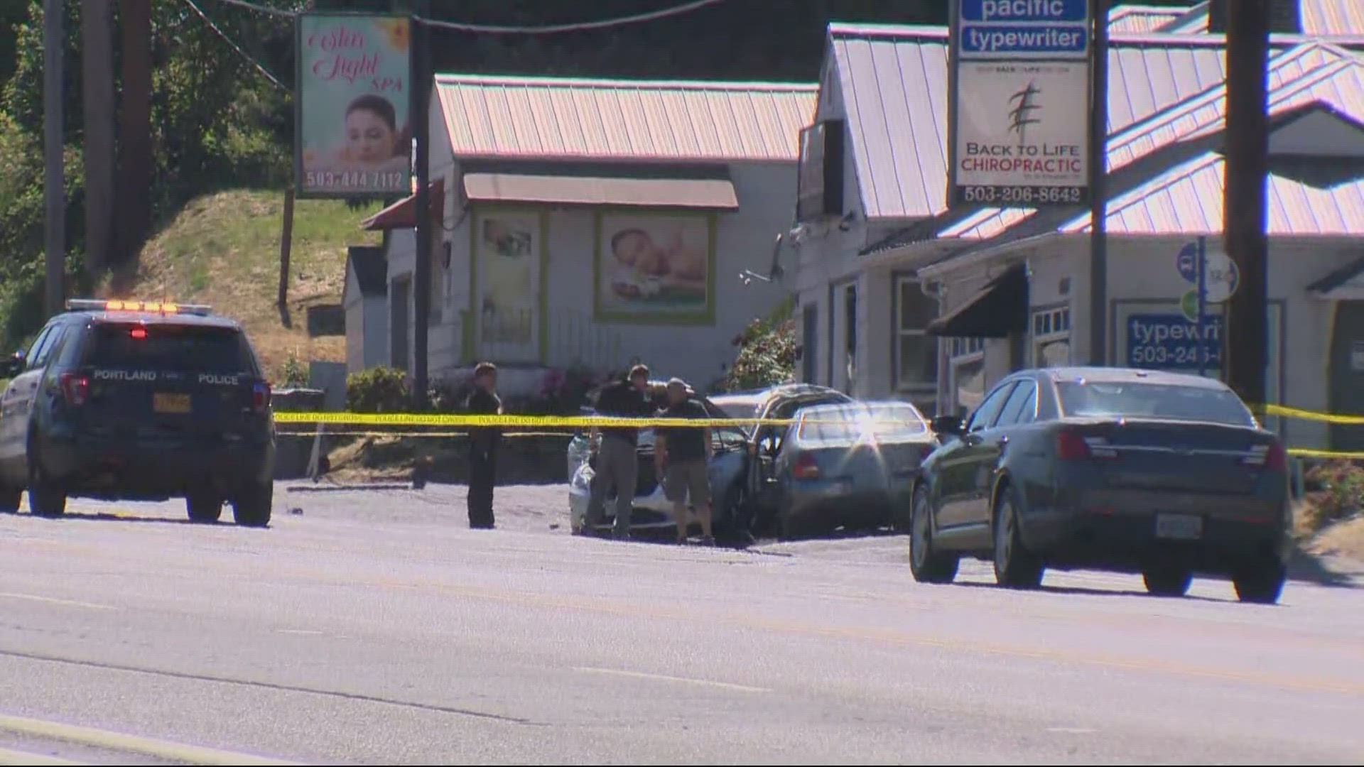 A woman died in the crash. Southwest Barbur Boulevard is closed in both directions between Southwest Capitol Highway and 30th Avenue.