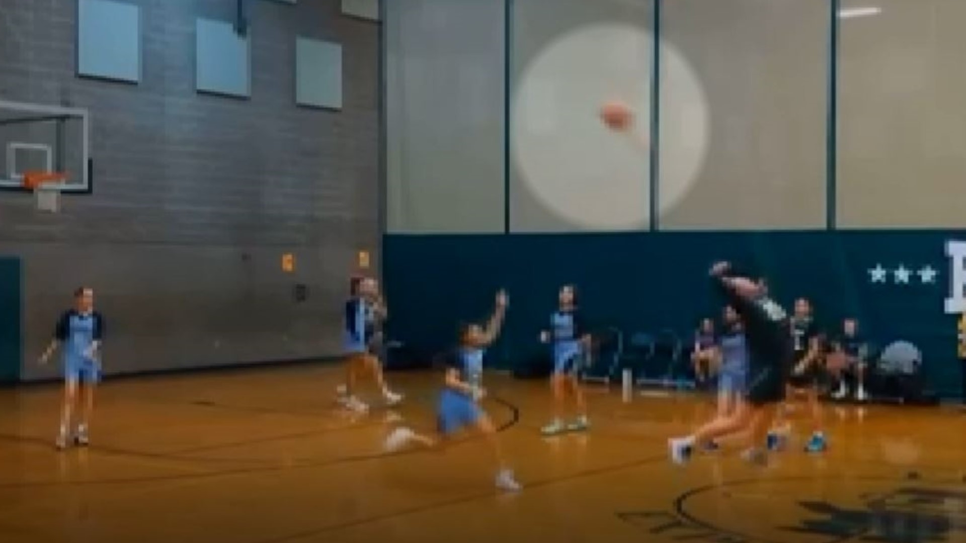 Audrey Jackson hits backwards shot from halfcourt just after the buzzer at Thomas Jefferson Middle School in Vancouver, Wash. Video from Tara Jackson.