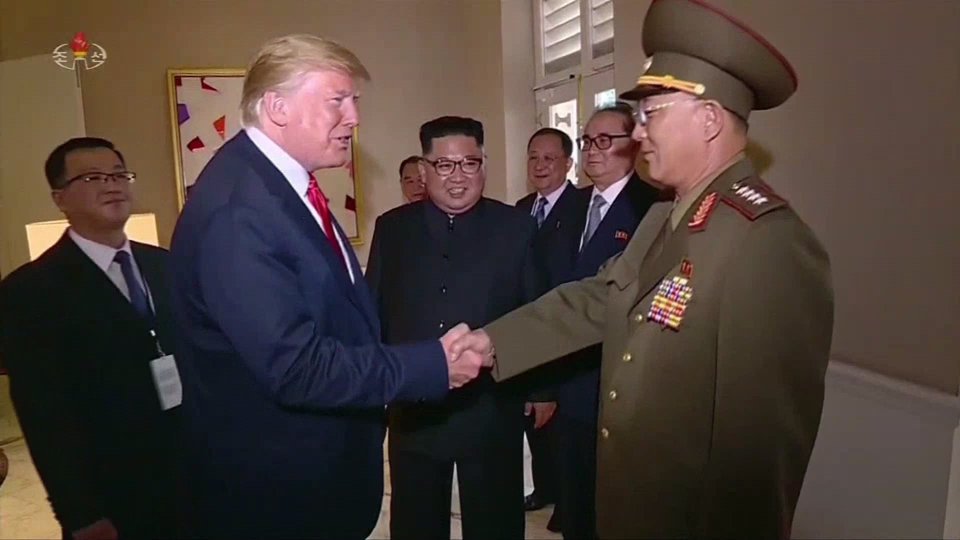 North Korean state television aired video from the historic summit between President Donald Trump and Kim Jong Un Thursday that included a surprising moment when the American president saluted a North Korean general.