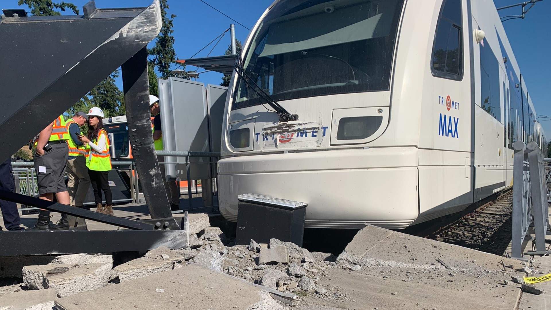 A driver of a MAX train in Milwaukie failed to stop at the end of their line, injuring themselves and two passengers Friday morning.