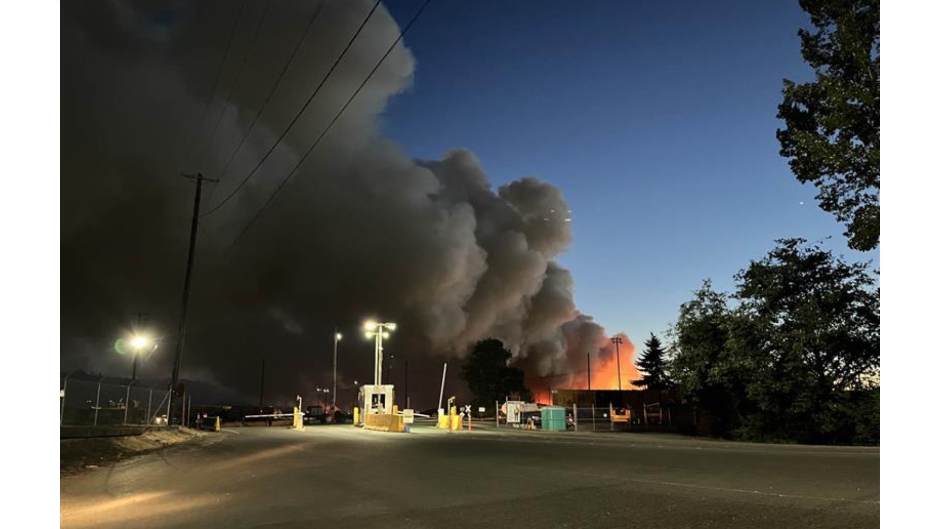 The fire broke out at Weyerhaeuser paper company on Industrial Way. The fire is contained to the woodchip piles. No injuries have been reported.