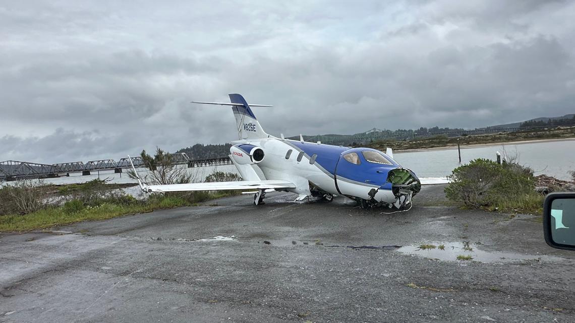 Small plane skids off runway into water in North Bend; 5 people
