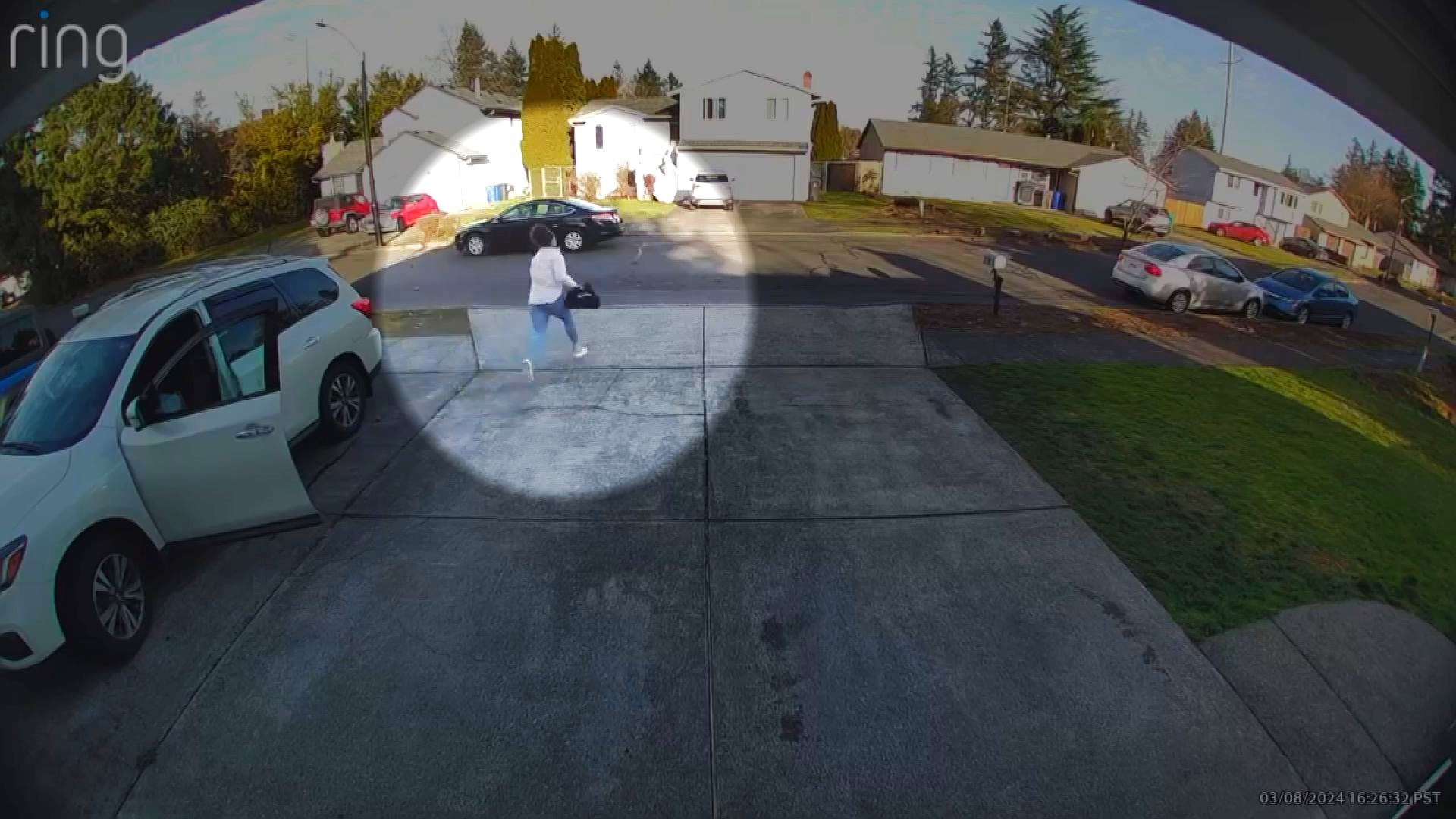 A Gresham woman was robbed in her driveway. Ring video shows a woman approach Chitta Nix and tell her that she dropped something at an ATM blocks away.