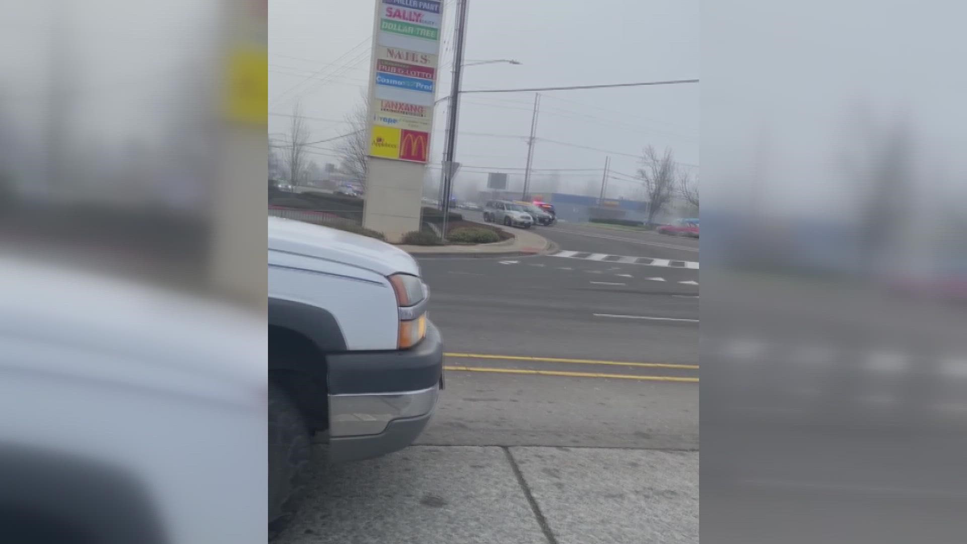 Drivers at the intersection of Kuebler and Commercial Street SE in Salem this morning were stuck waiting as a gun battle raged outside of a nearby auto parts store.