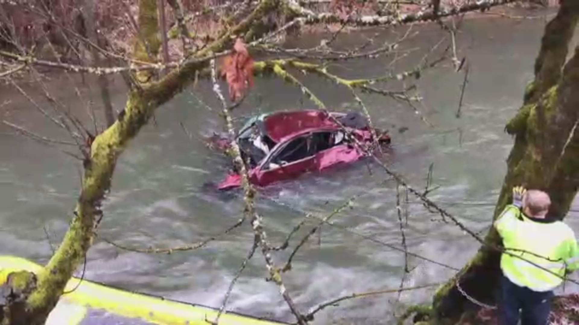 A woman who was a passenger in a car that plunged into a Washington County, Oregon creek is rescued on Feb. 15.