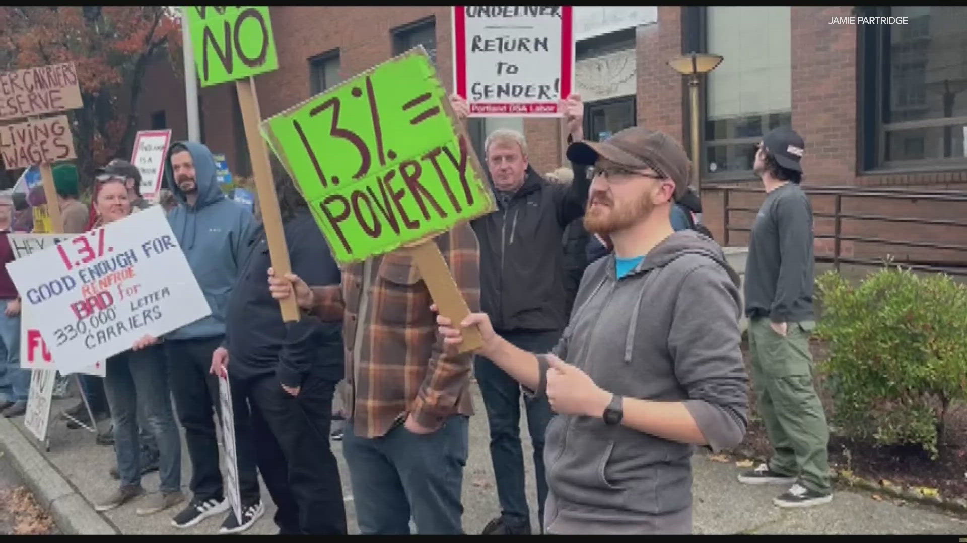 Portland Branch 82 of the National Association of Letter Carriers rallied in front of the East Portland Post Office Sunday.