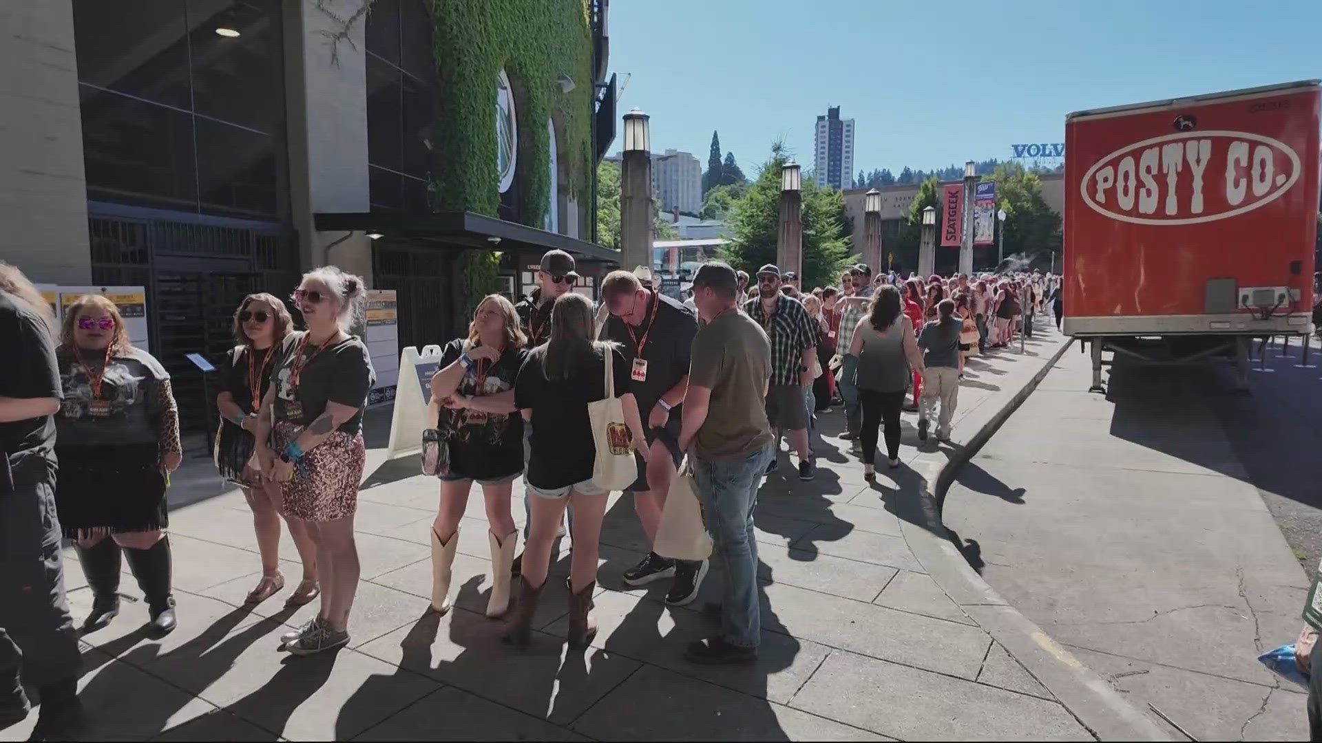 Thousands of people wait in long lines outside Providence Park to get into Post Malone and Jelly Roll concert in Portland. 
