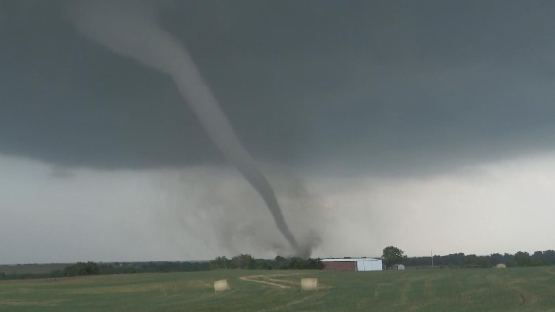 Storm chasers caught the tornado as it moved across the ground and threw debris into the air in Oklahoma on Sunday. It was one of several tornadoes over the weekend.
