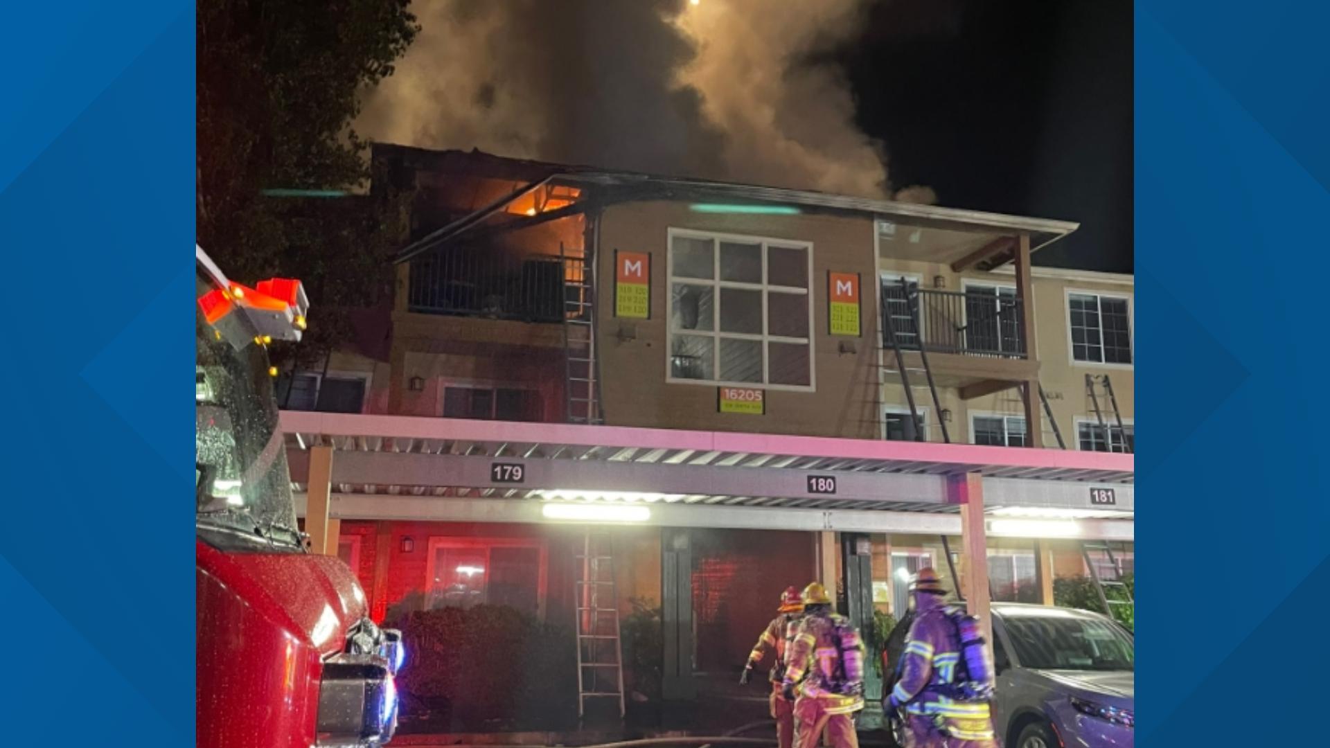 Multiple people called 911 to report seeing flames coming from the roof of a housing complex on Southwest 108th Avenue early Wednesday morning.