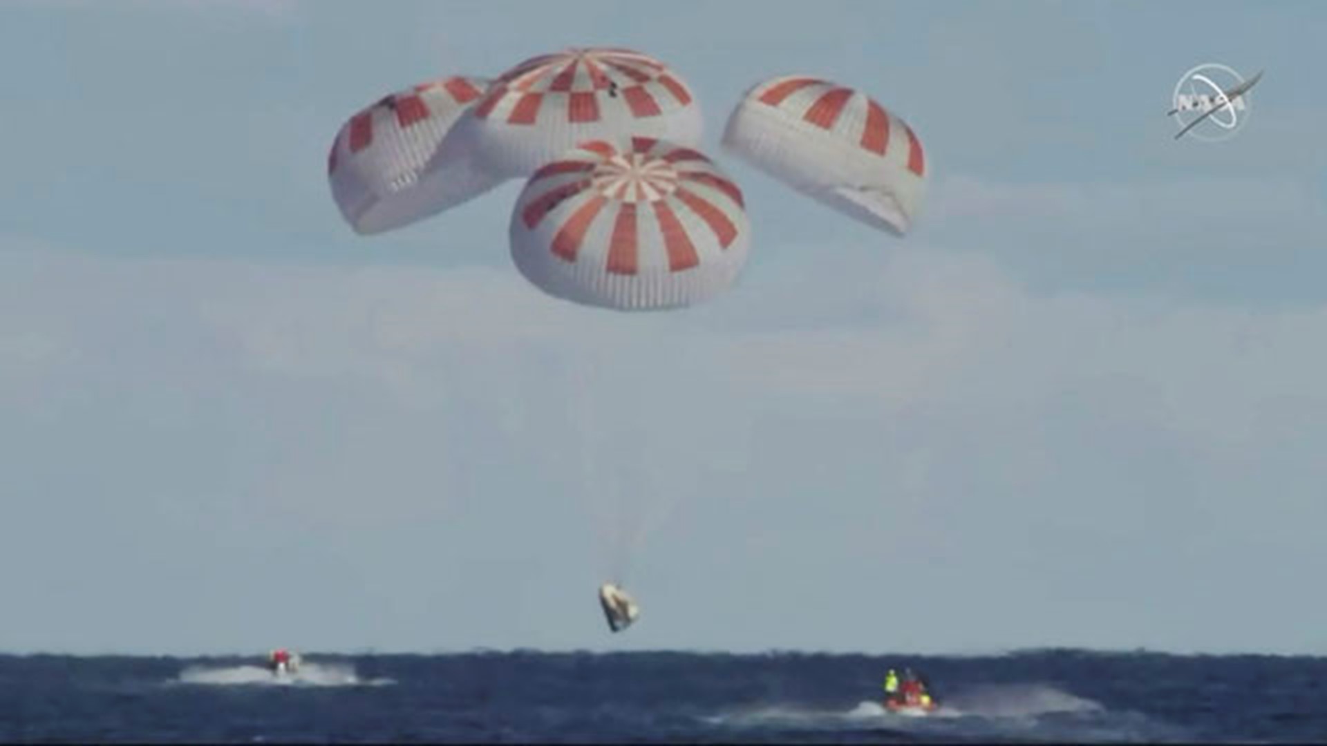 NASA provided amazing video of the SpaceX splashdown, starting with parachute deployment shortly after the capsule enters the Earth's atmosphere.