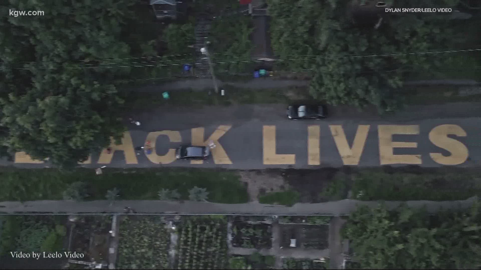 An artist painted Black Lives Matter on a Portland street in St. Johns, with Portland’s racist past written in the letters.