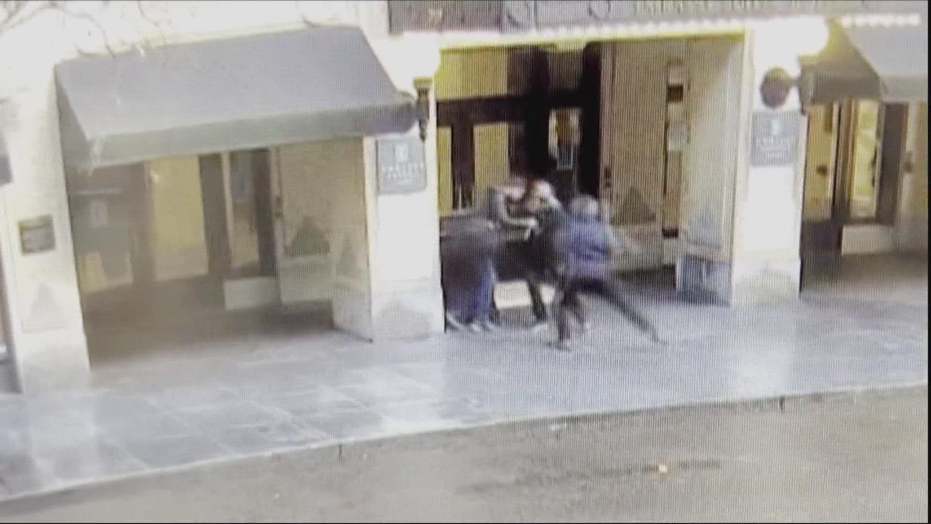 An unknown assailant injured two men in a seemingly random attack outside a Portland hotel in January. Security footage captured the unprovoked assault.
