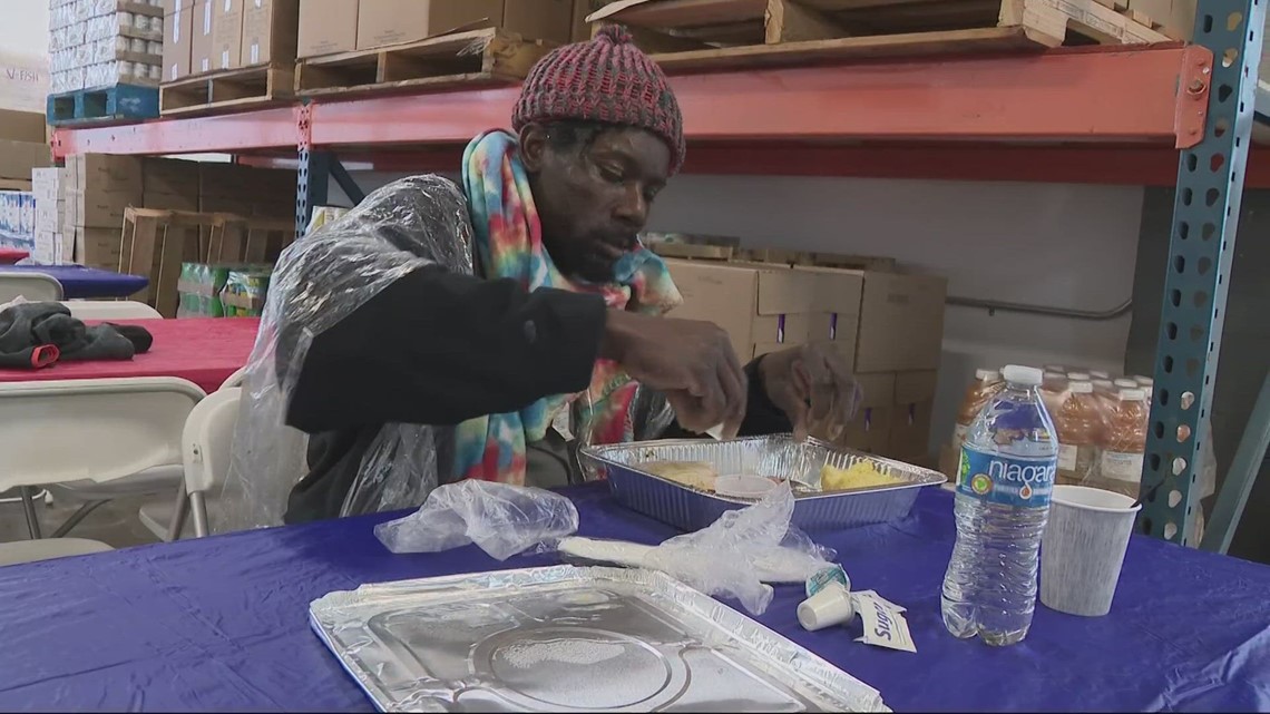 Volunteers serve hot meals to those in need on Christmas