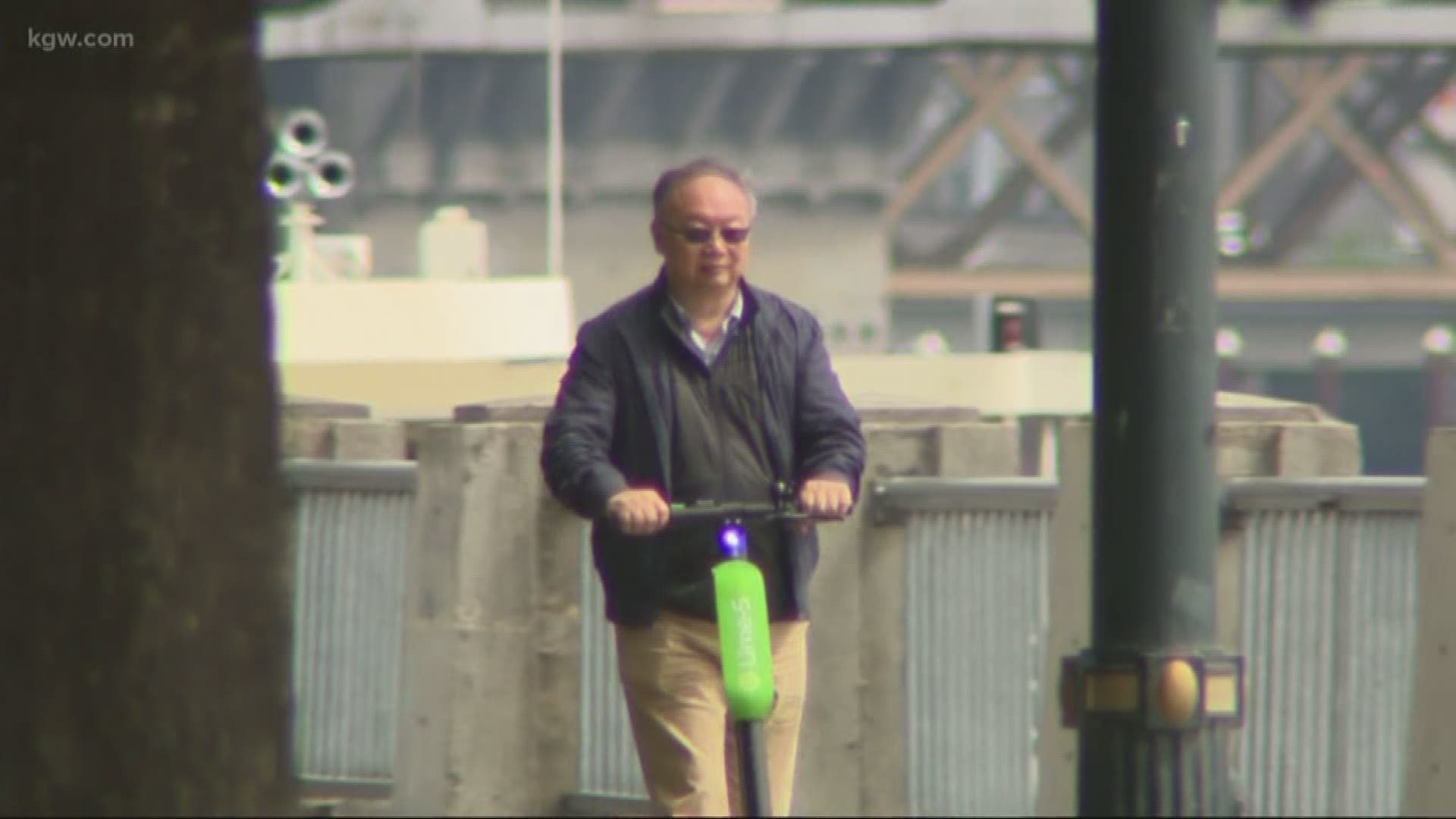 Many scooter riders are not wearing helmets.