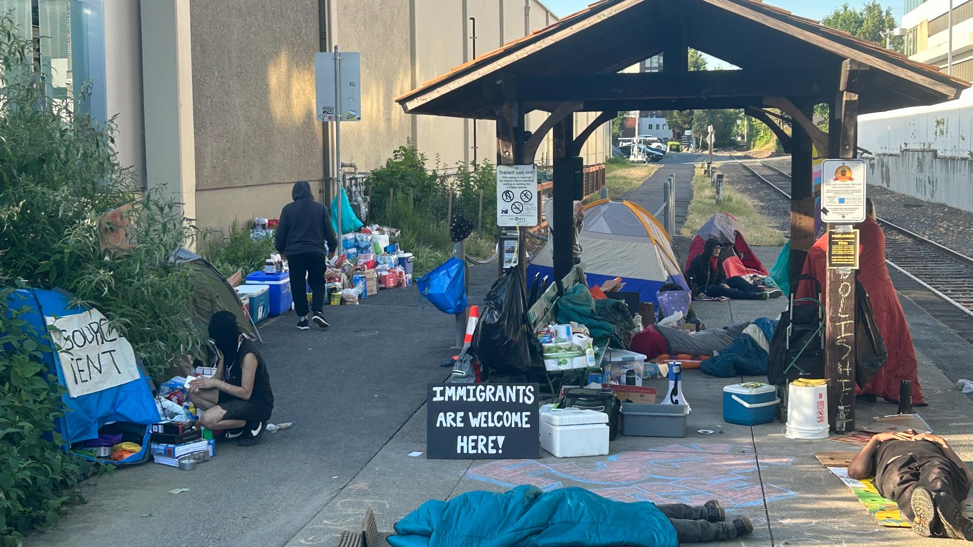 A small group of people protesting ongoing raids and deportations gathered outside the ICE facility in Southwest Portland Tuesday morning. 