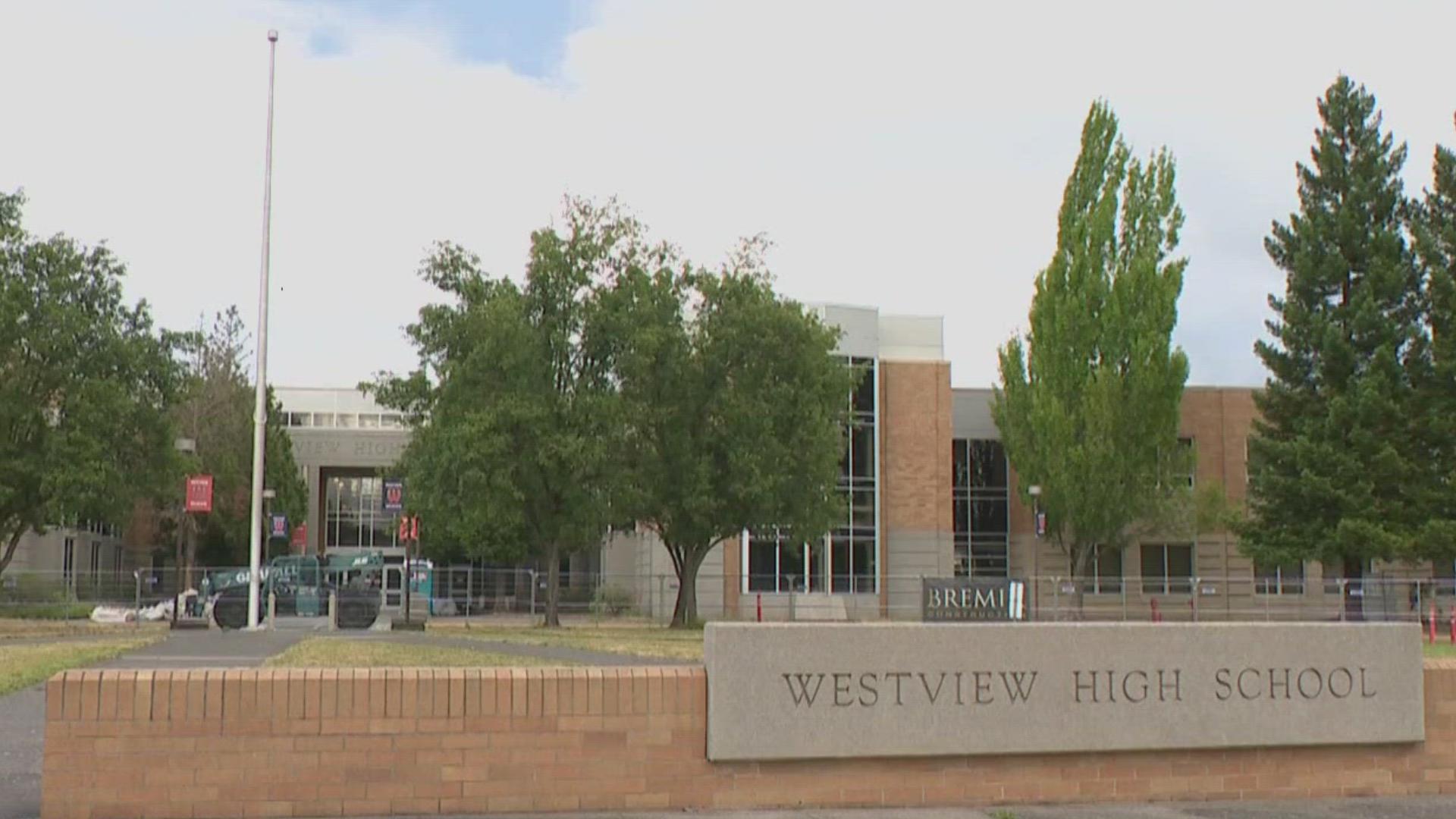 Westview High School's former head football coach was arrested on 12 counts of harassment for allegedly waking up students by slapping and shaking them.