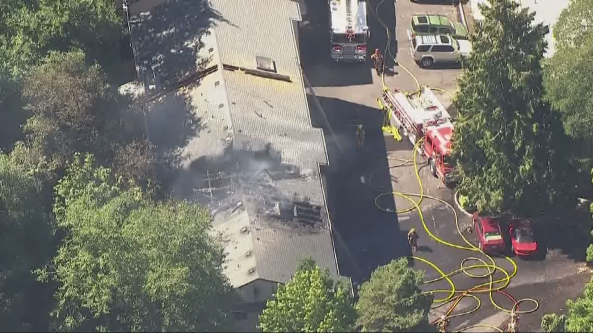 A man died after jumping out of a burning apartment building in Southwest Portland.