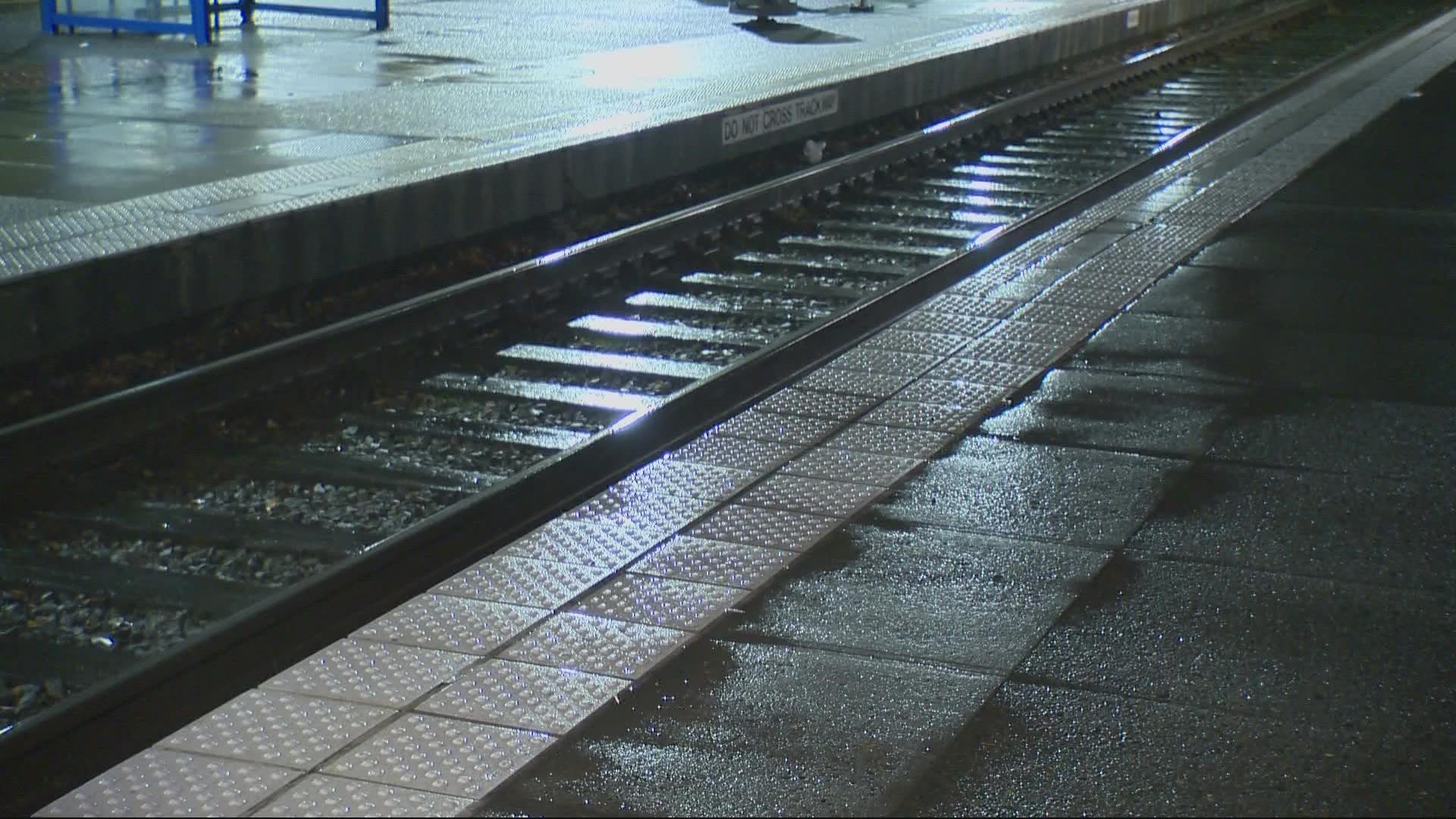 A woman pushed a 3-year-old off the Gateway Transit Center station platform and onto the tracks Wednesday. No train was coming and the child was not seriously hurt.