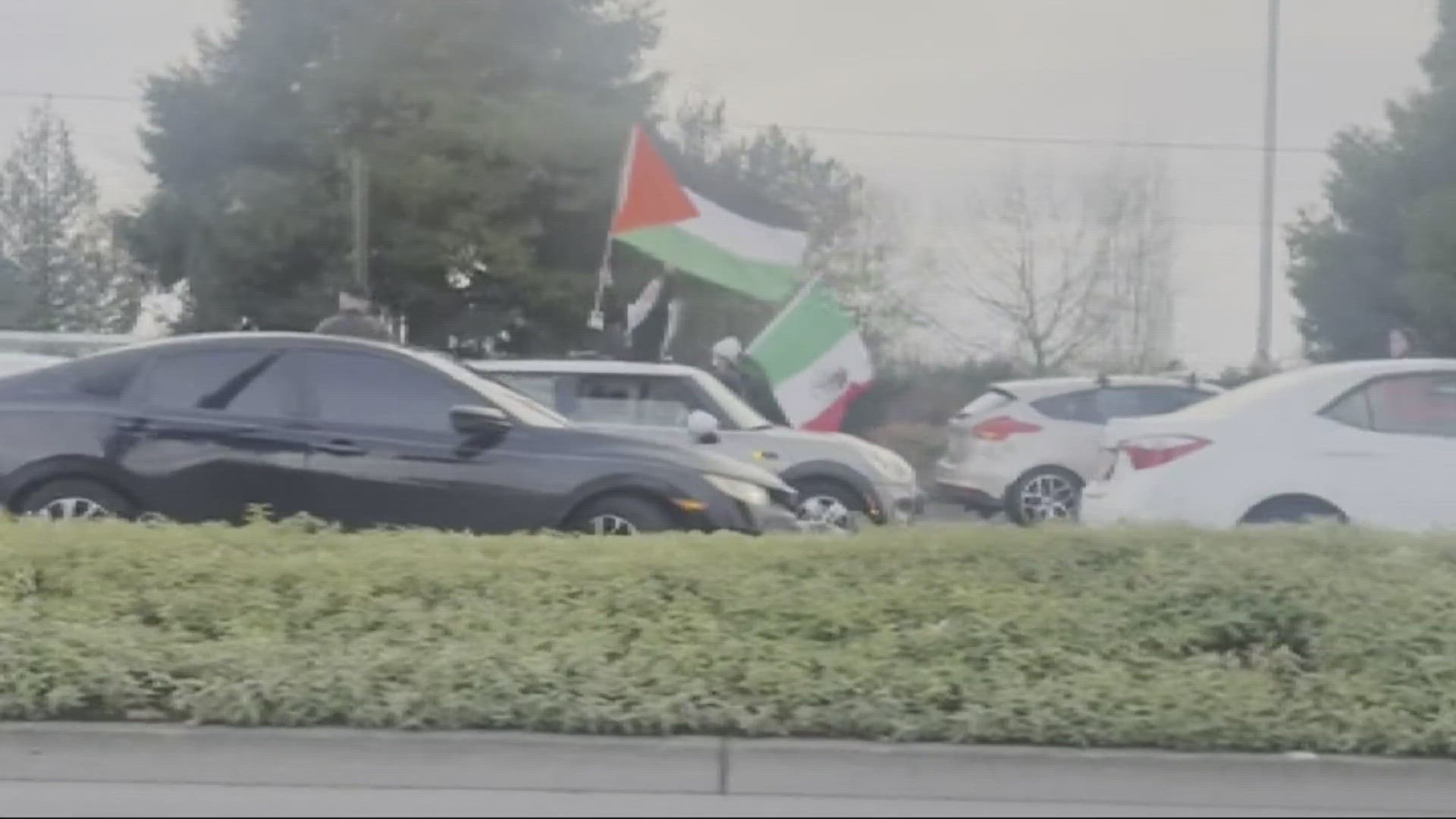 About 50 cars blocked inbound lanes on Airport Way to protest the war in Gaza.