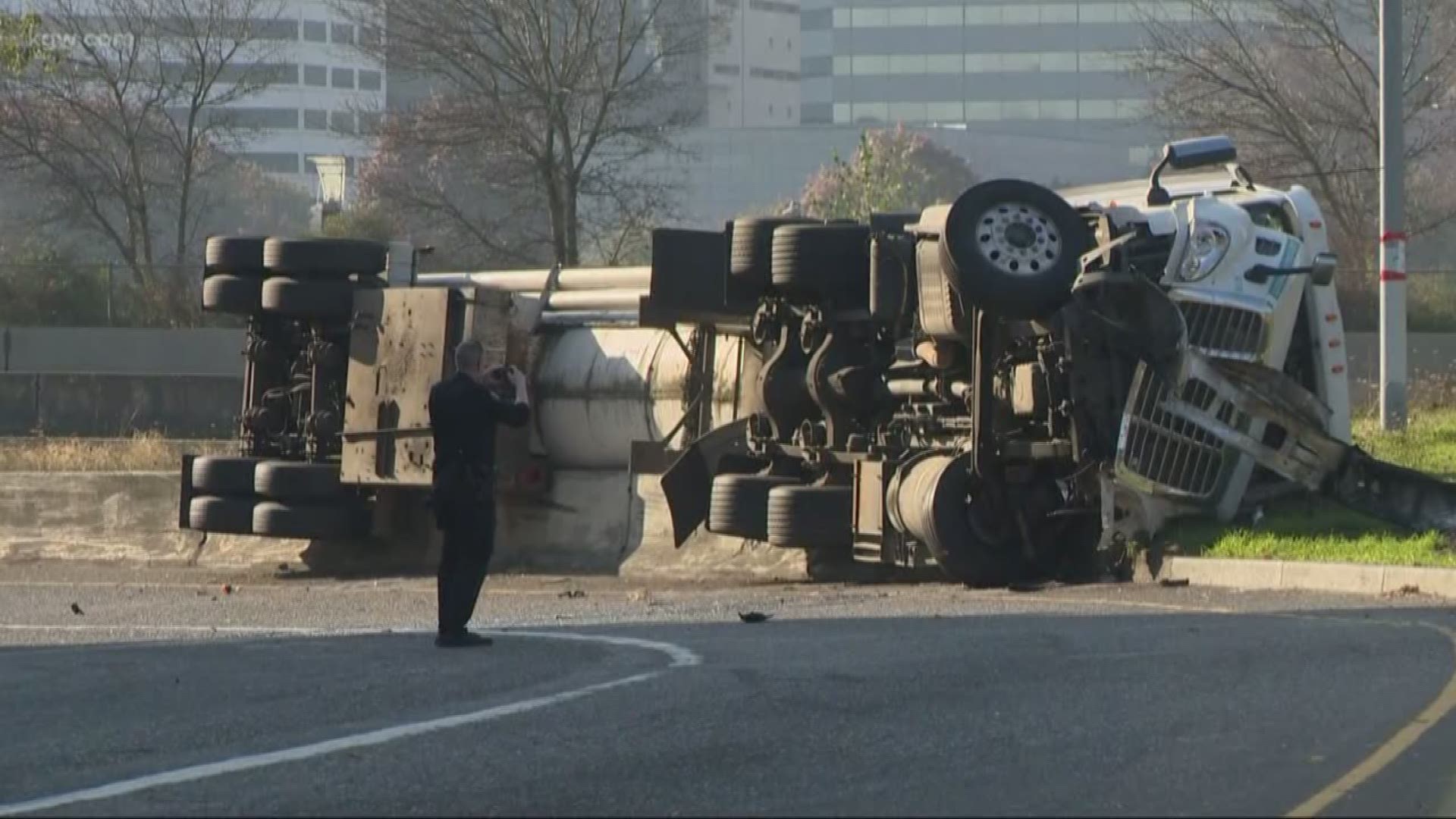 A semi trailer carrying carbon dioxide crashed into multiple cars before flipping on its side. As a precaution, ODOT closed all of I-5 for a short time.
