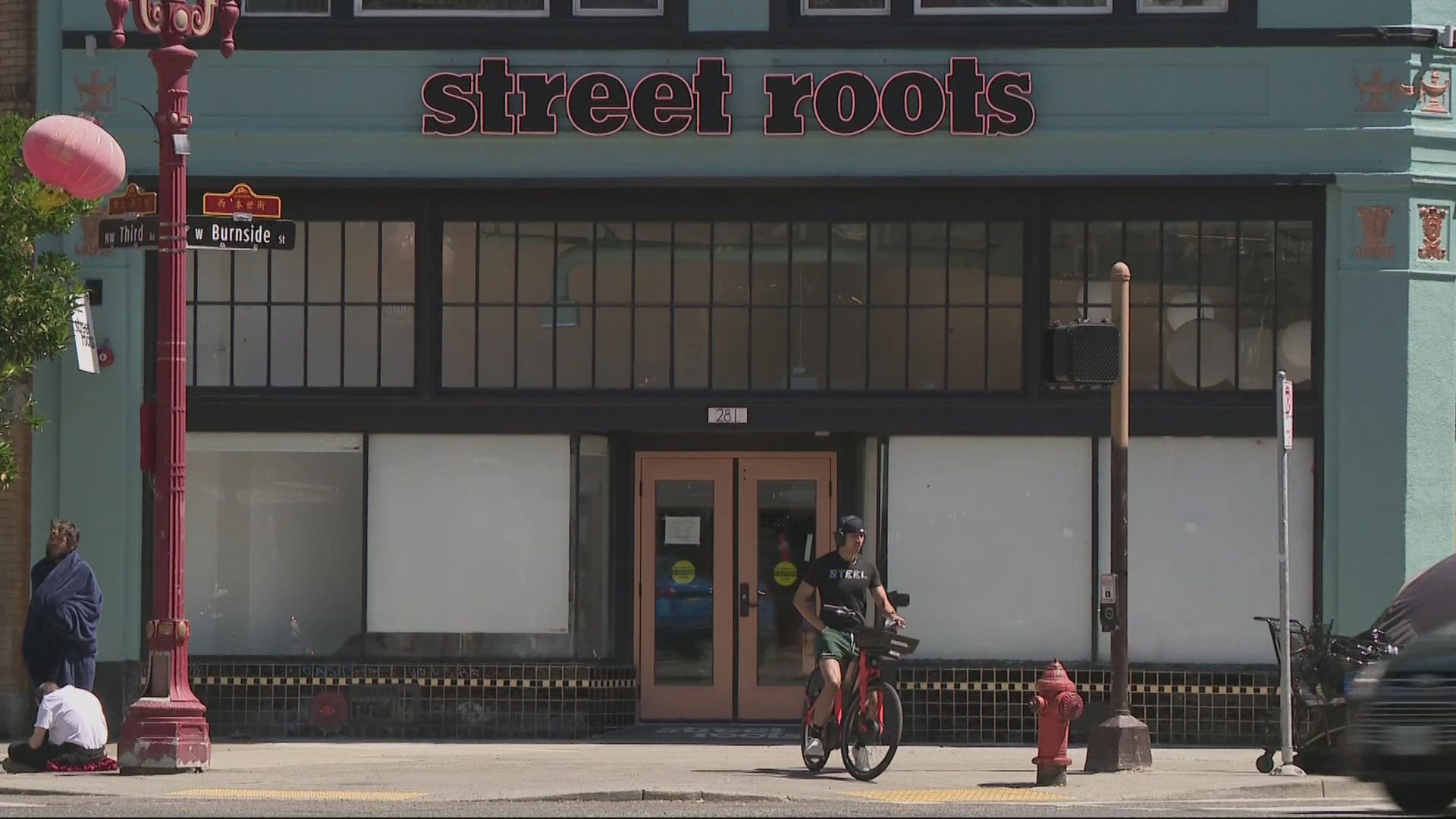 Street Roots has been set back $80,000 after a window was shattered at their facility, but they're still planning on opening with help from the community.