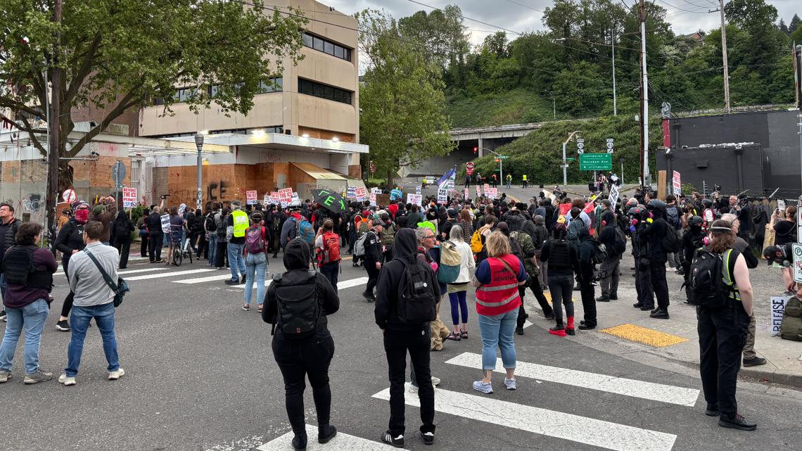 After a day of demonstrations across the city, hundreds of protesters converged on the ICE facility on Macadam Avenue...