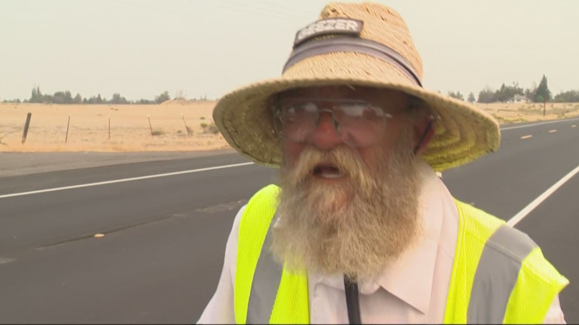 A man is walking across the country.