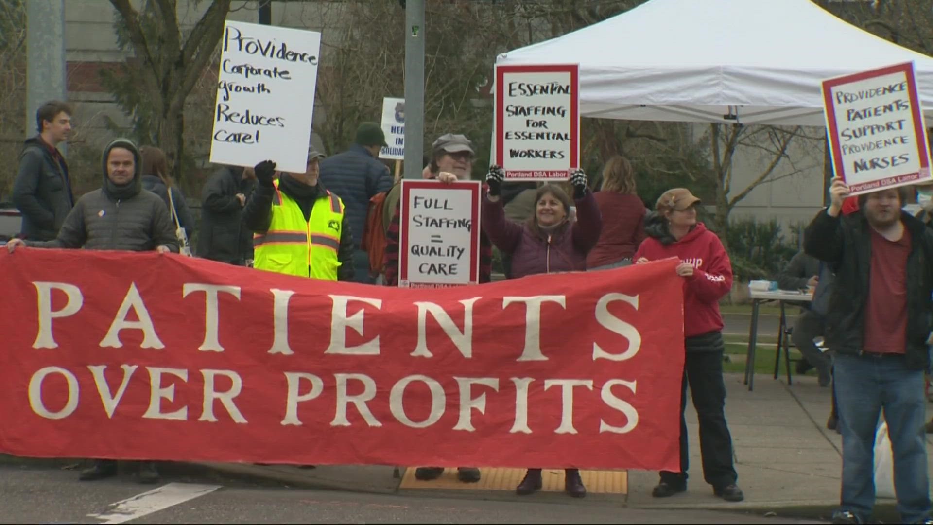 Outside the Providence Oregon headquarters on Friday, nurses lined up with signs, calling for strong contracts and “safe staffing.”