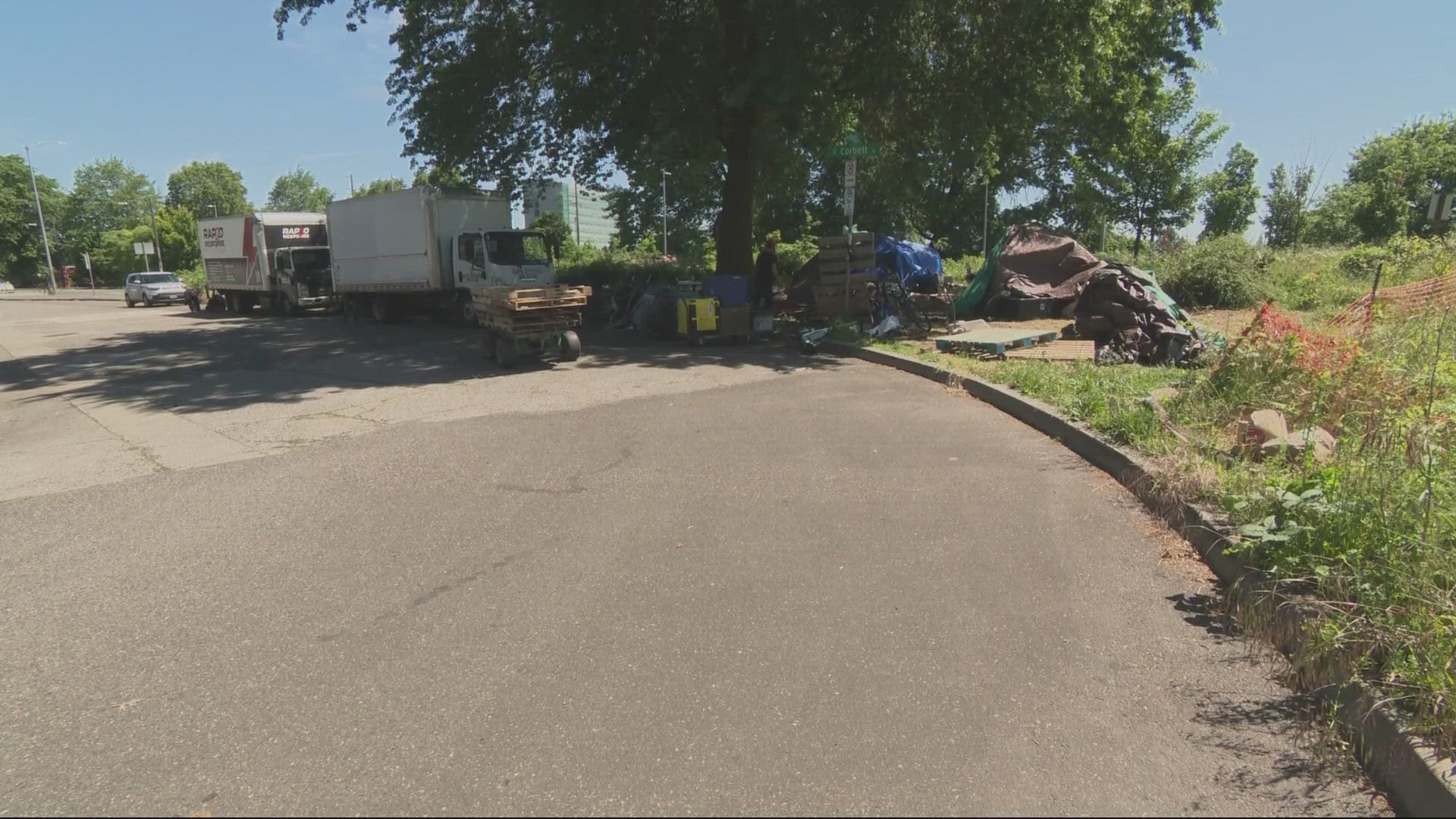 A homeless camp on the outskirts of downtown Portland continues to stall plans to construct affordable housing on the site.