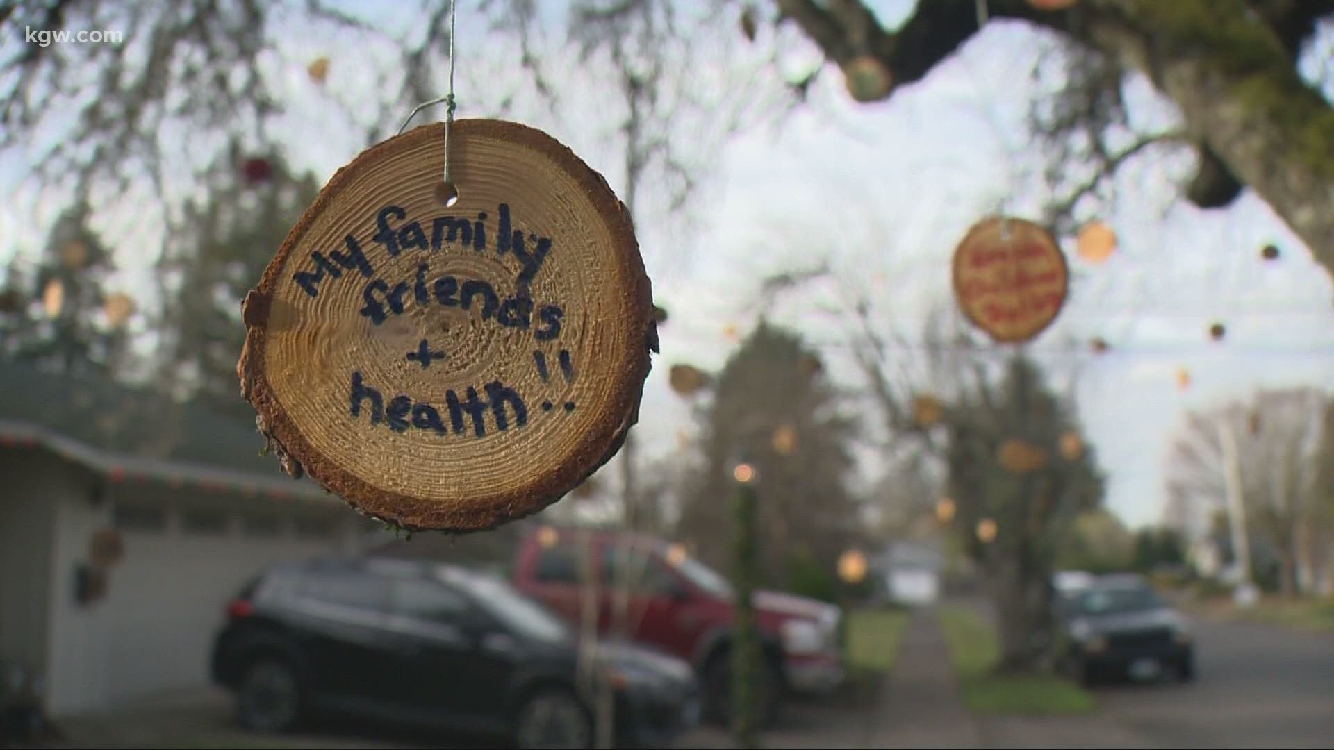 In a time when Christmas lights dominate neighborhood trees, a Beaverton family has a different idea.
Simple wooden circles decorate their branches. Here's why.