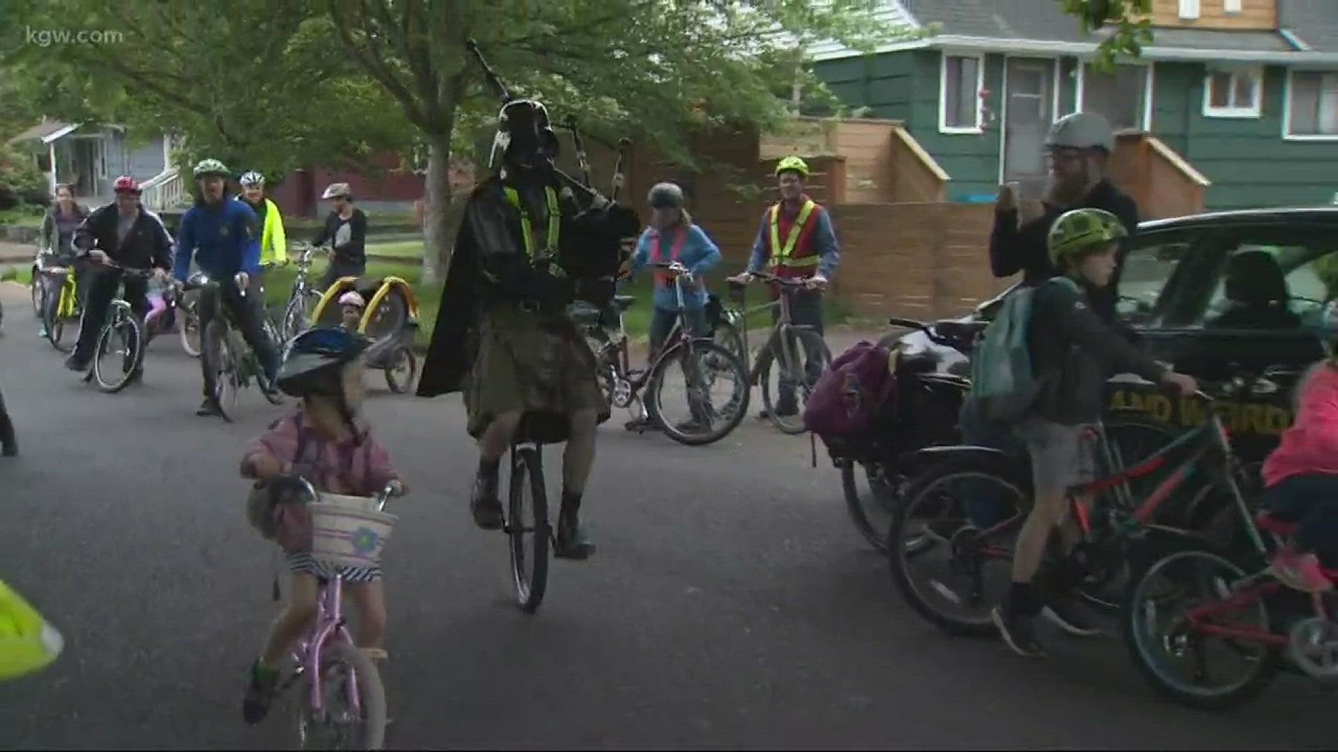 Porltand's Unipiper led the students for a National Bike to Work Day recognition.