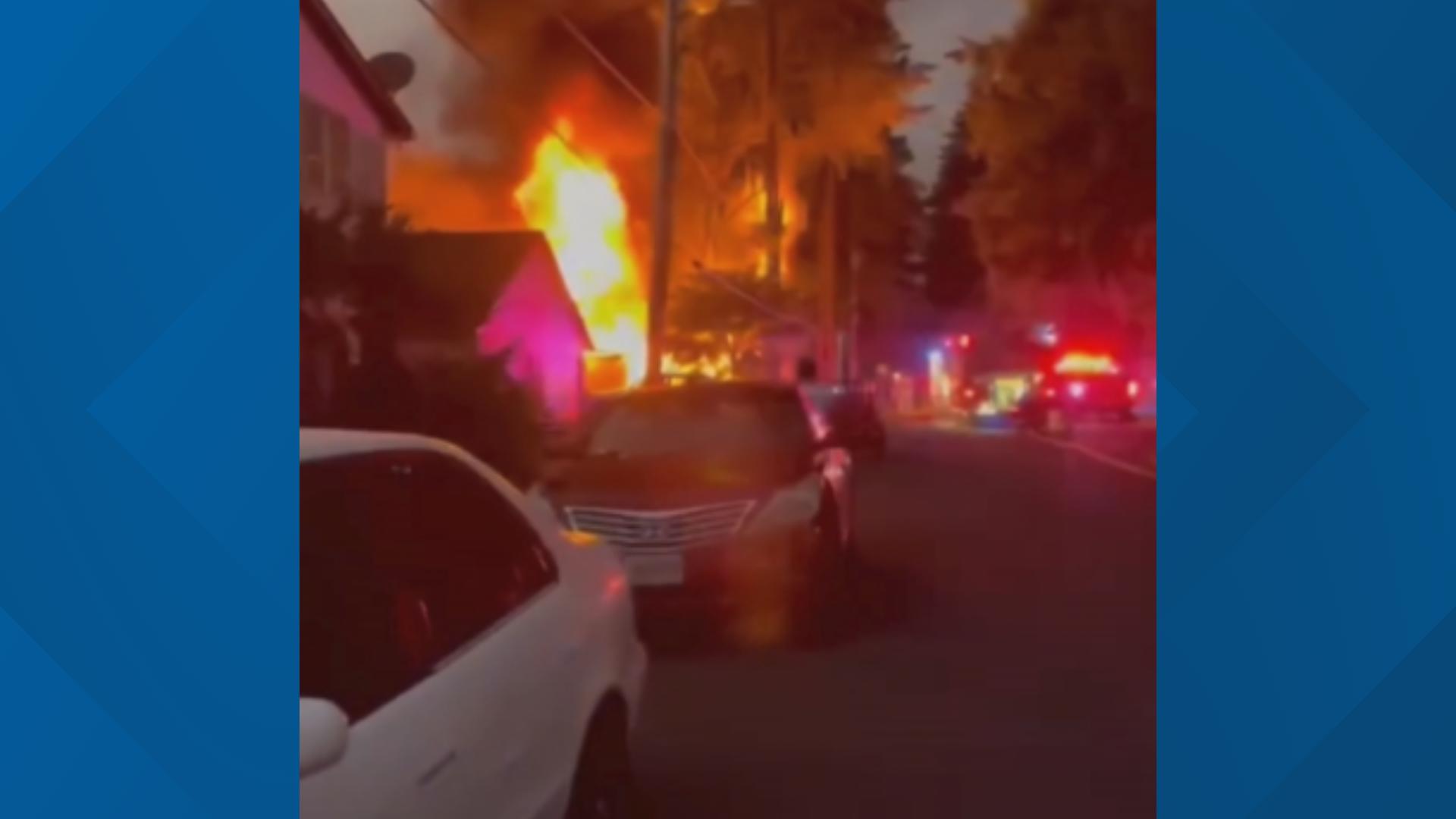 A couple was hospitalized after their house caught fire in Gresham on Sept. 5, 2024. A neighbor shared video of tall flames and large plumes of smoke.