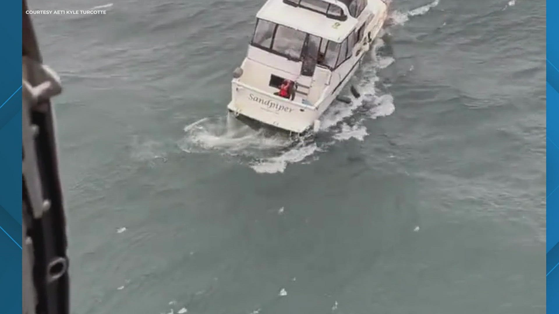 Coast Guard air crews received a may day call and responded to attempt to rescue a person on a vessel. As a swimmer approached the boat, a wave caused it to capsize.