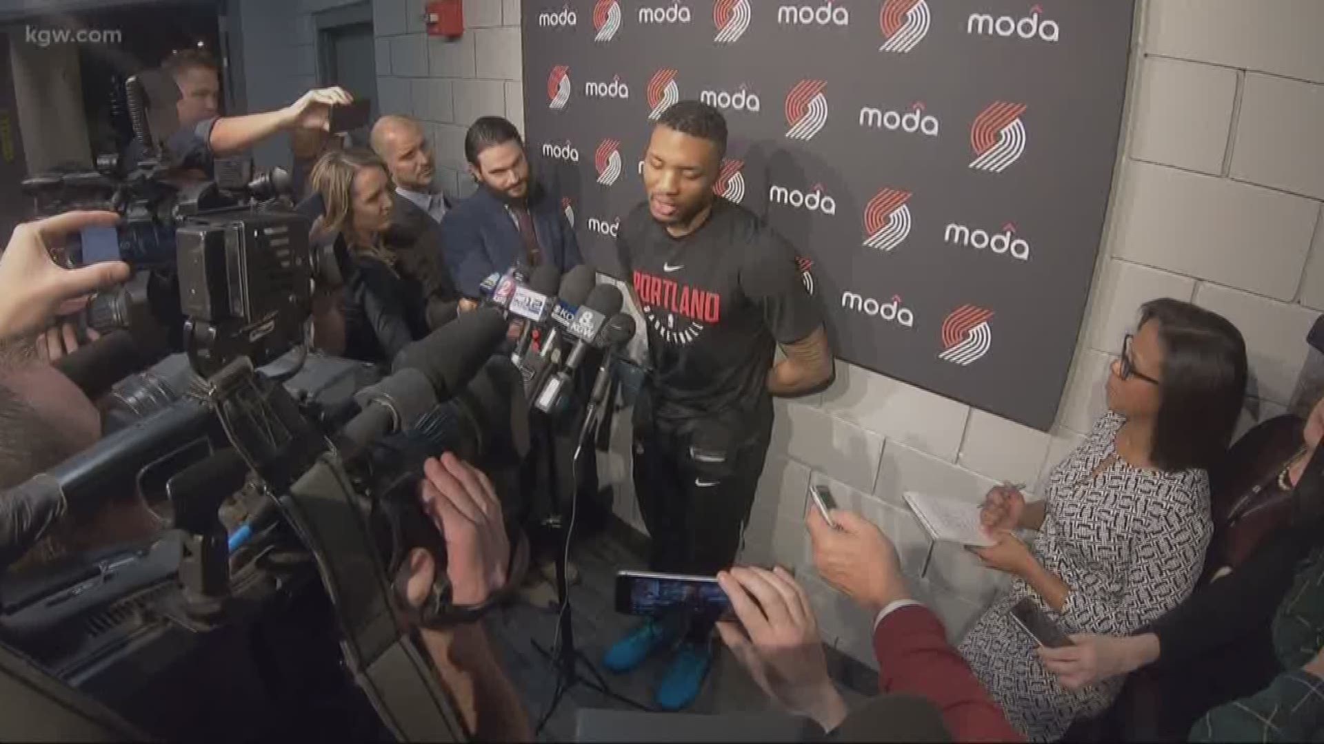 Portland Trail Blazers guard Damian Lillard reacts to the birth of his child and the shooting of his half brother in the same day.