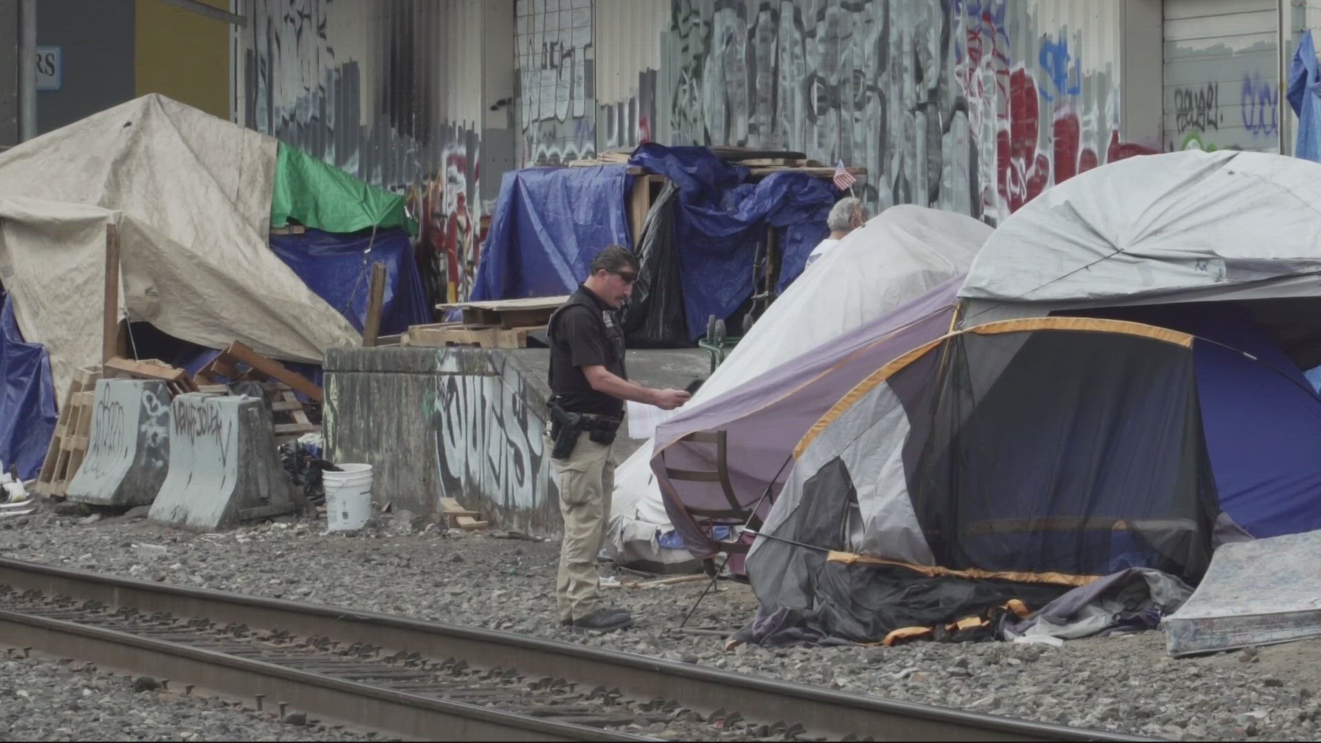 Residents camped near the railroad tracks said the area feels secluded and safe, despite the noise from passing trains