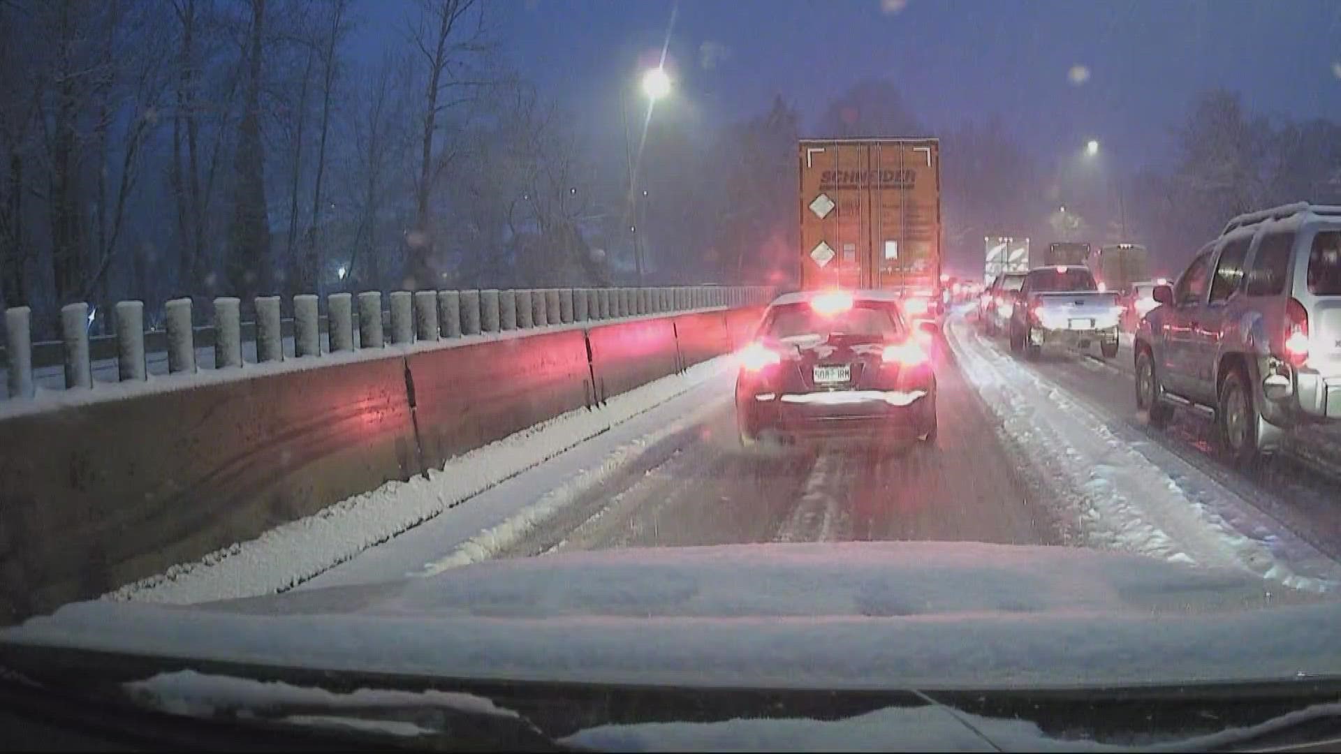 Snow brought traffic in Portland to a standstill during Wednesday's afternoon commute. Many major roadways were slick, slowing down traffic.