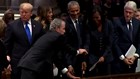 George W. Bush sneaks more candy to Michelle Obama at his father’s funeral
