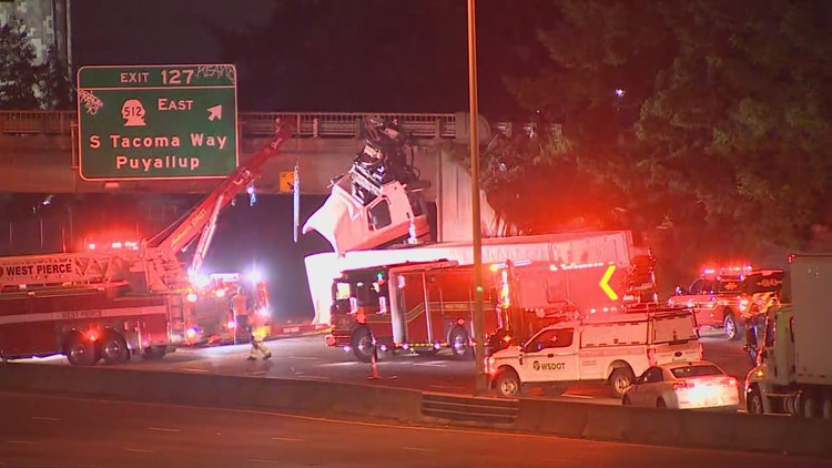 Semi-truck that dangled off overpass after crash causes back-up in Lakewood, Washington