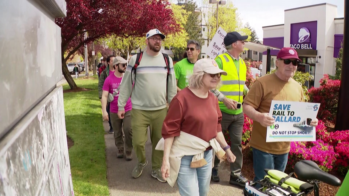 Residents in Seattle's Ballard neighborhood march to save voter-approved light rail extension