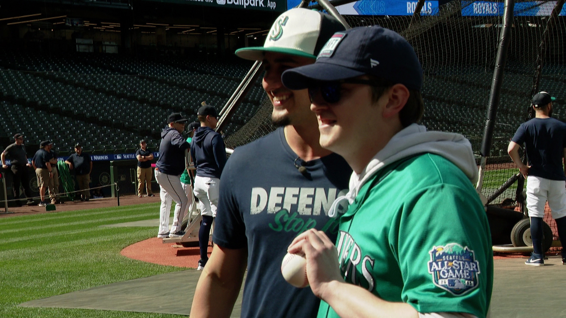 Josh George, right, poses with Mariner Josh Rojas. George caught two consecutive foul balls at Monday night's game.