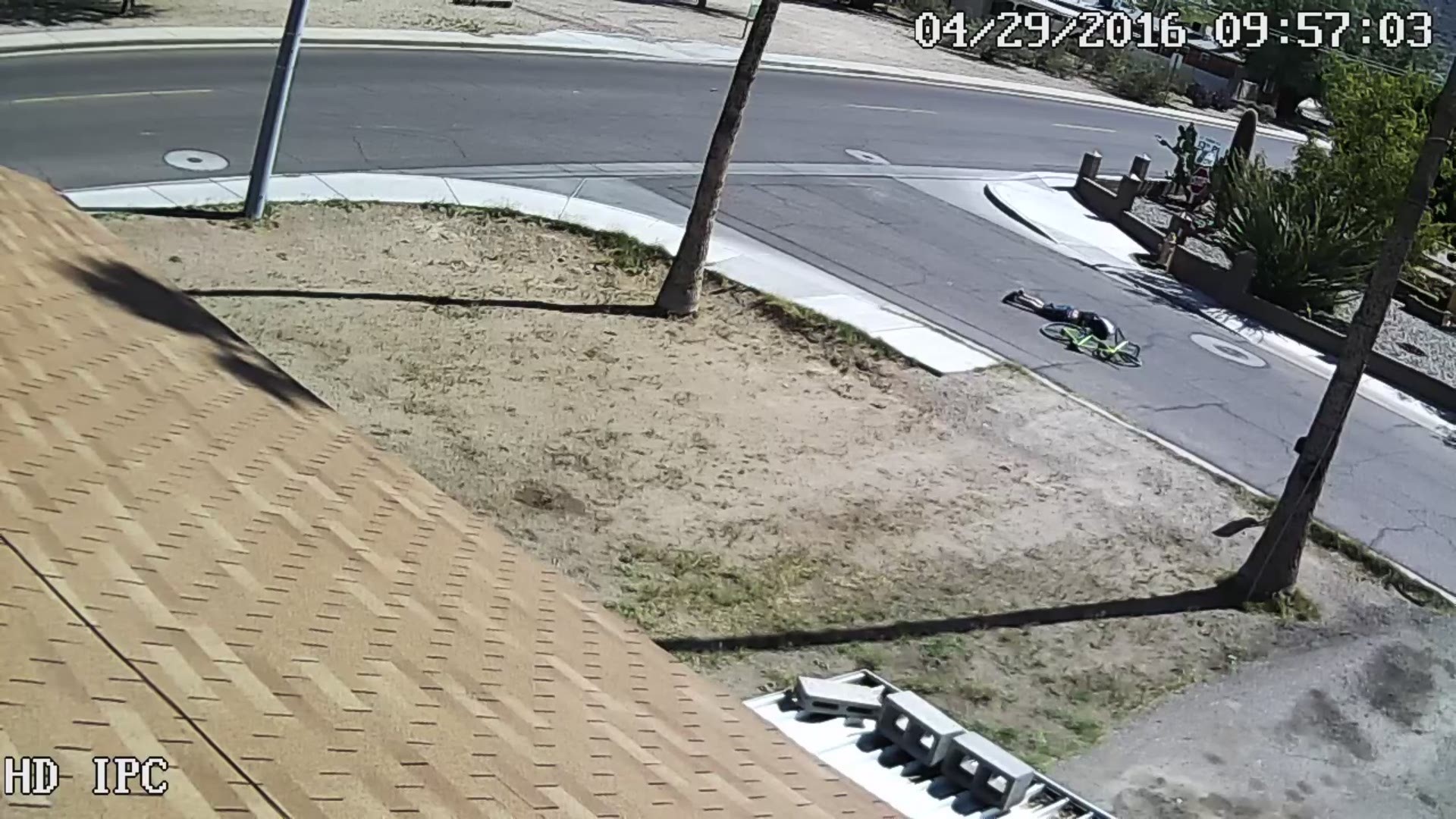 Security footage captured a car running over a man on a bike. Source: BlueHorse Solutions LLC